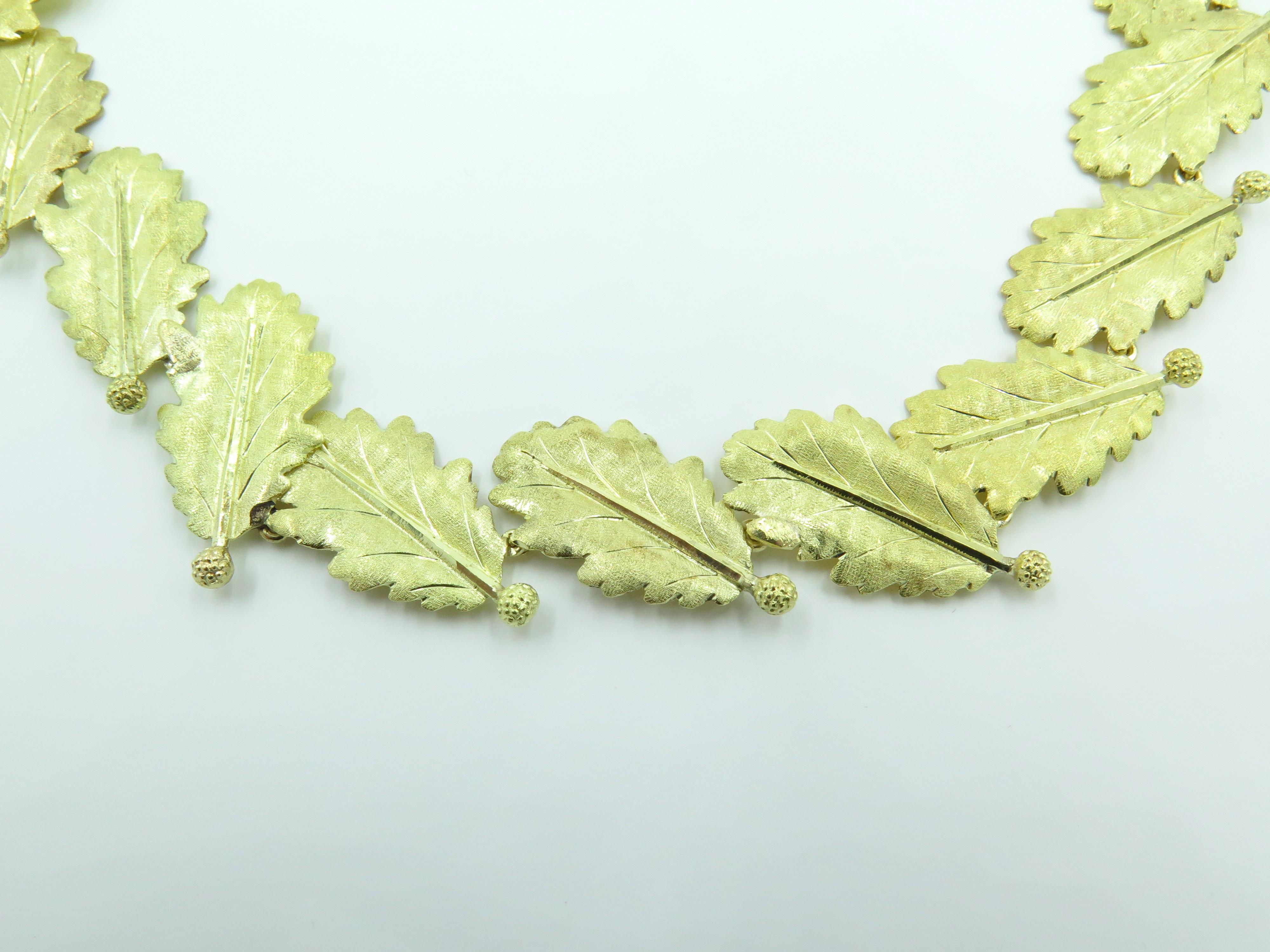 An 18 karat yellow gold necklace. Mario Buccellati. Circa 1970. Designed as a line of  textured gold oak leaves, enhanced by small textured acorns. Length is approximately 16 inches. Gross weight is approximately 41.2 grams.
