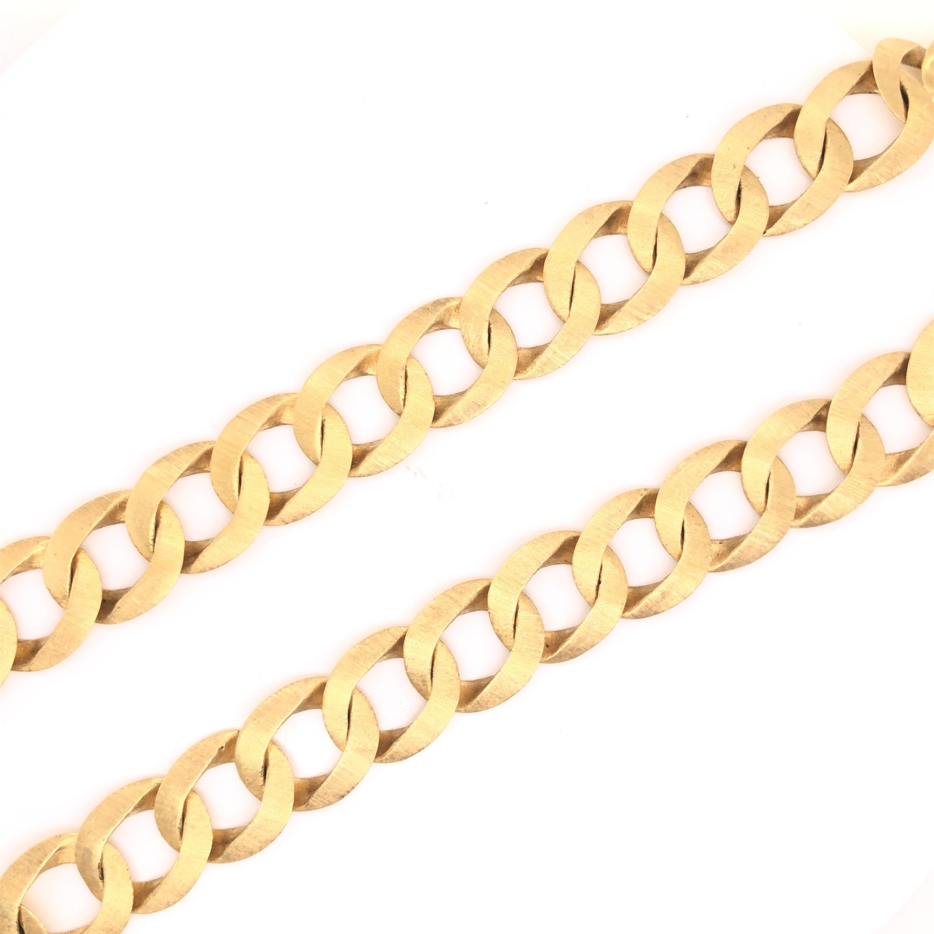 Beautiful classic design by famed designer Mario Buccellati. This vintage necklace has never been more in style than today. The necklace is crafted in 18k yellow gold and shows a satin finish on the front portion of the design.  The wide open link