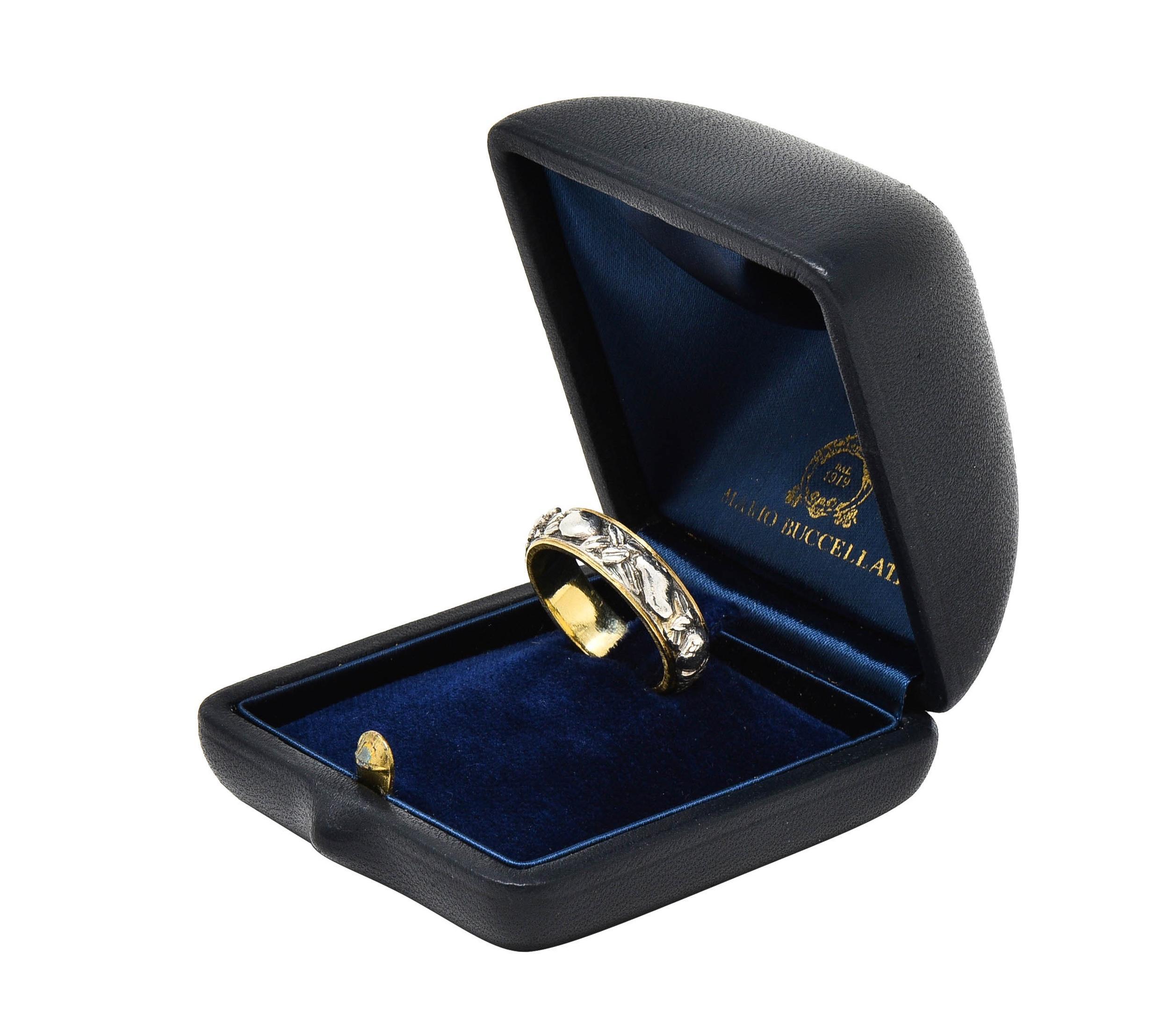 Designed as a yellow gold band centering carved renderings of fruit and foliate 
Comprised of silver oranges, pears, grapes, and leaves fully around
Deeply grooved with oxidized detailing throughout
Accented by linear engraved gold profile
Stamped