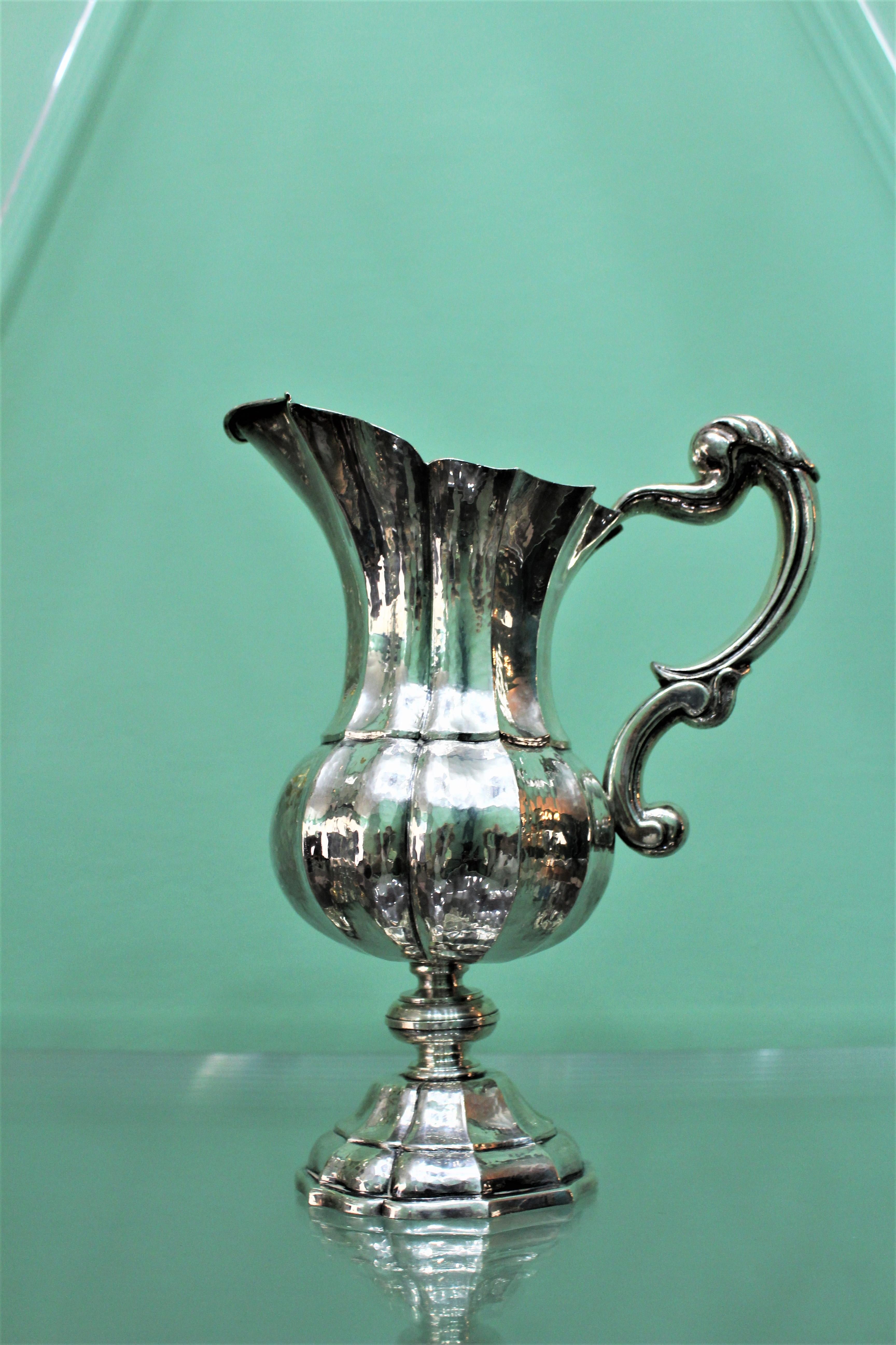 Wonderful art deco sterling silver carafe by Mario Buccellati, Italy.
Realized circa 1920s, hand embossed and hammered with perfect technique.
The size are 26 cm height and 21 cm width weight 980 gr.
Good conditions.
Perfect for being used on