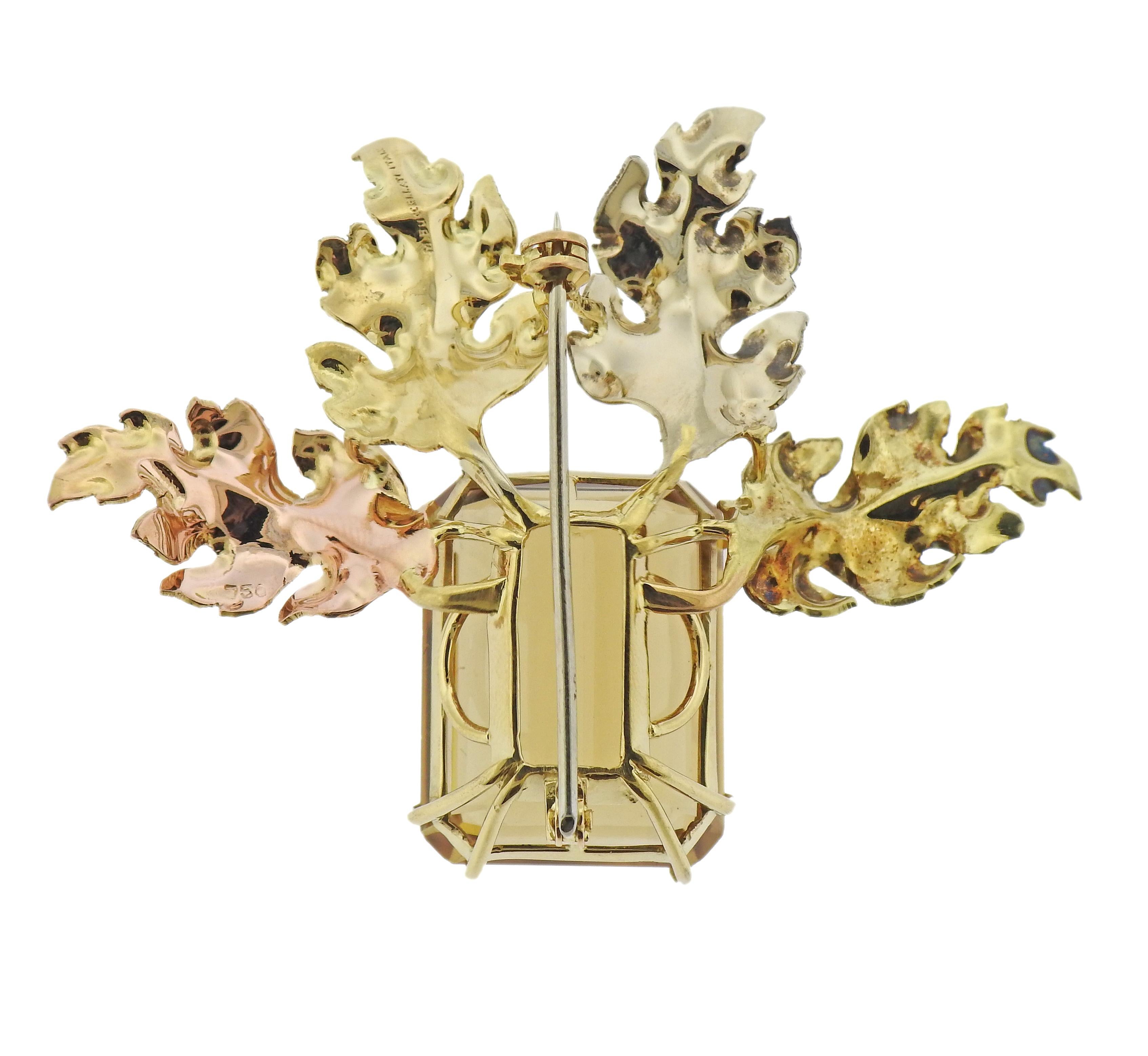 18k tri color gold leaf motif brooch, crafted by Mario Buccellati, adorned with approx. 32.5-33 carat citrine (stone measures 22.85 x 17.6 x 12.2mm). Brooch measures 1 7/8