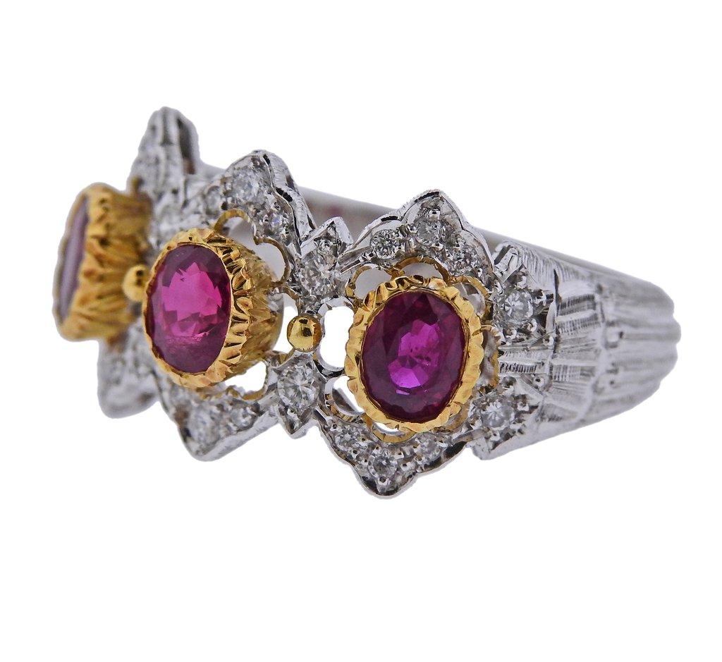 mpressive 18k white and yellow gold ring by Mario Buccellati, set with oval rubies, and approx. 0.38ctw in diamonds. Comes with COA. Ring size - 6.75, ring top is 13mm wide and weighs 7.9 grams. Marked M. Buccellati,  Italy, 750.
