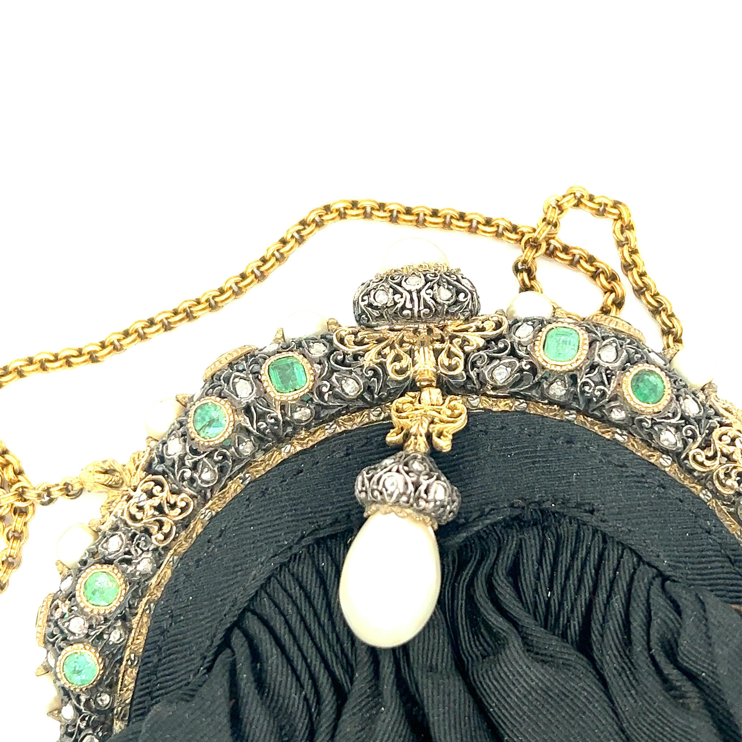 Mario Buccellati Frame Black Pouch Bag with Pearl

Rose-cut diamonds, various sizes of emeralds of approximately 2.5 carats, natural saltwater pearl (10 mm); set on yellow gold and silver

Size: width 4.5 inches, length 5.75 inches
Total weight: