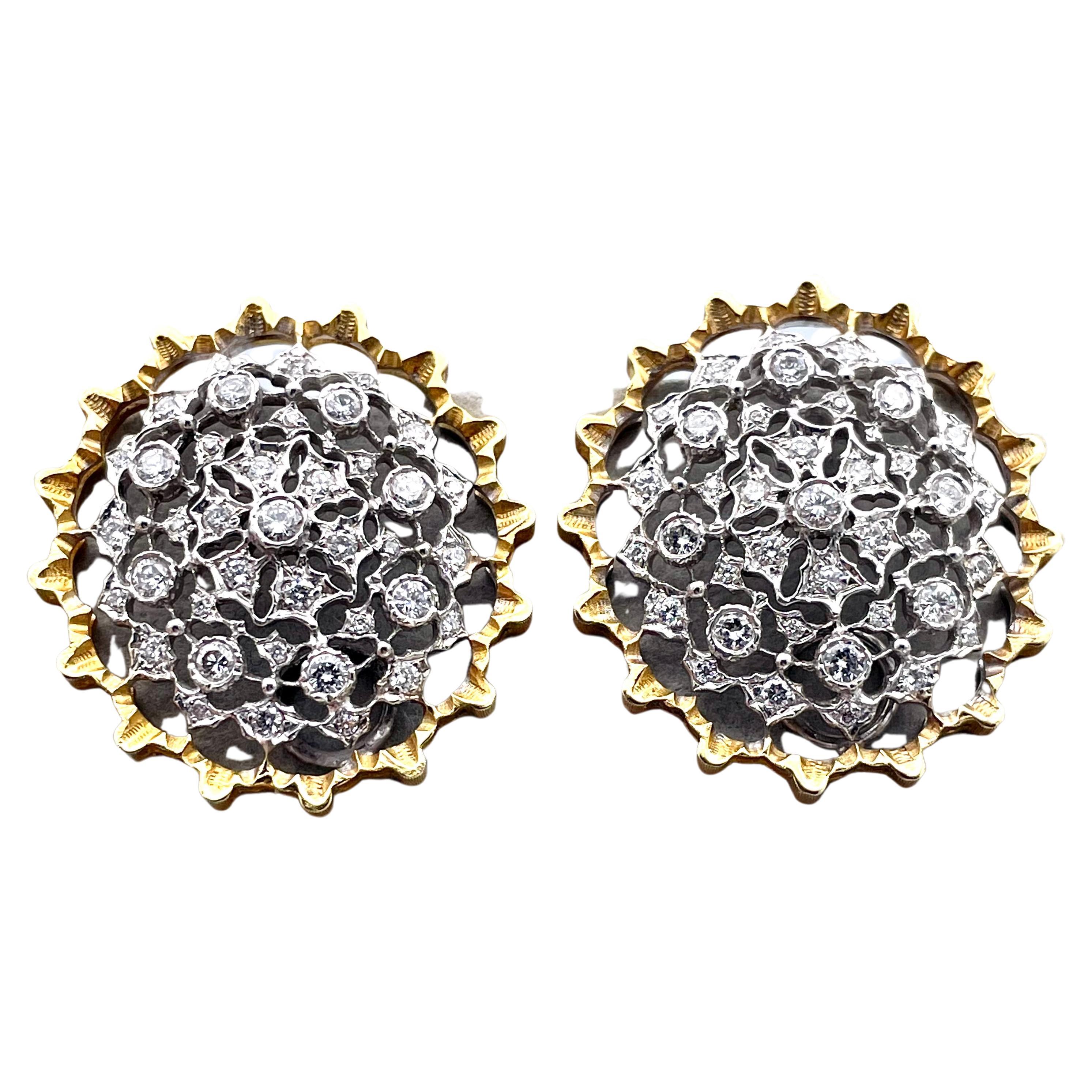 Big and bright ear clips. Made and signed by MARIO BUCCELLATI.  18K yellow gold scalloped borders, with intricate diamond-encrusted cut-out center.  Approximately 1.20 carats of shimmering faceted stones. 1