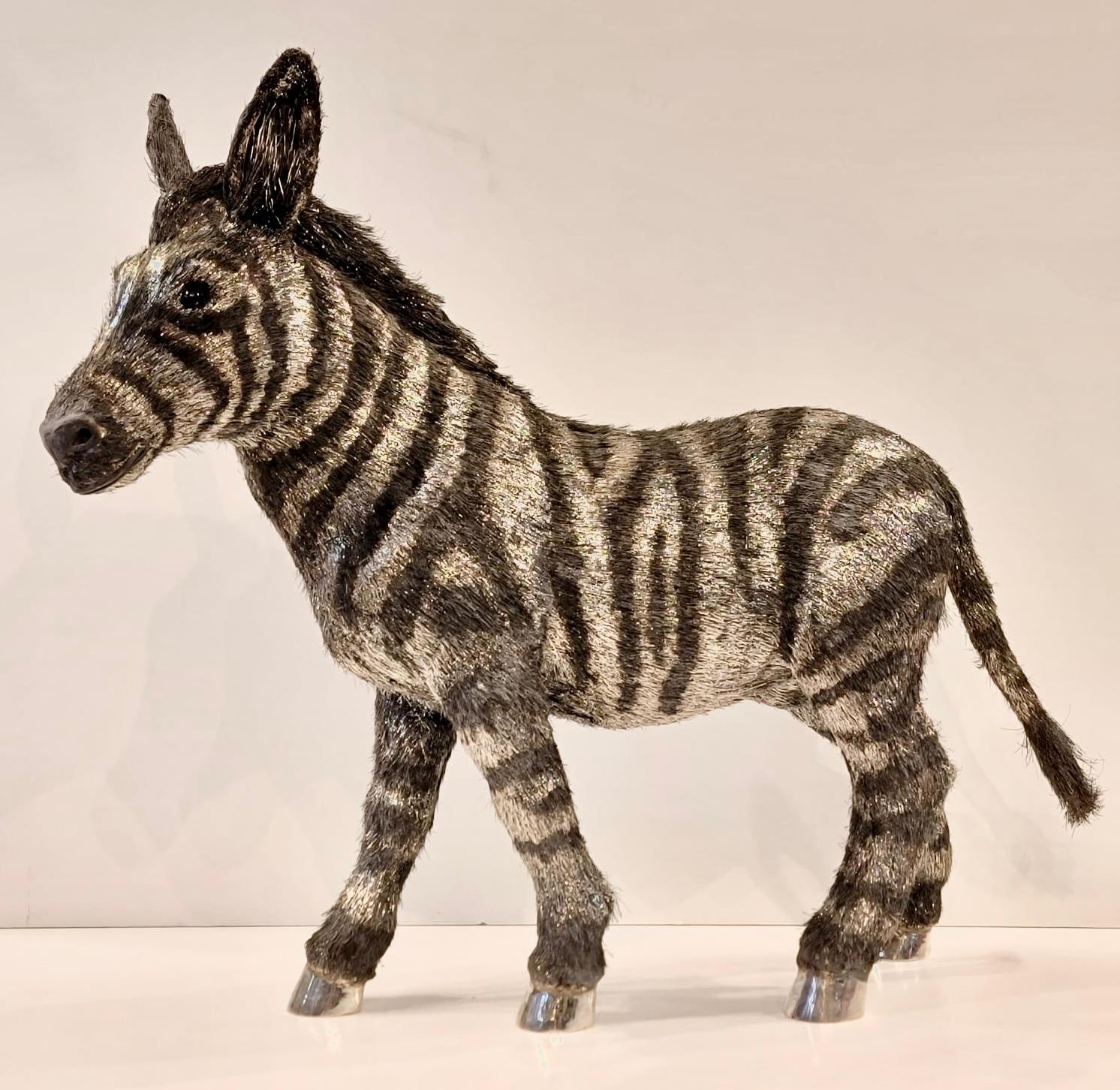 Mario Buccellati life size silver Zebra. A life-size silver zebra crafted with a technique know as ‘lavorazione a pelo’ or ‘hair-like workmanship. This technique involved infinite silver filaments of varying length and thickness being welded to