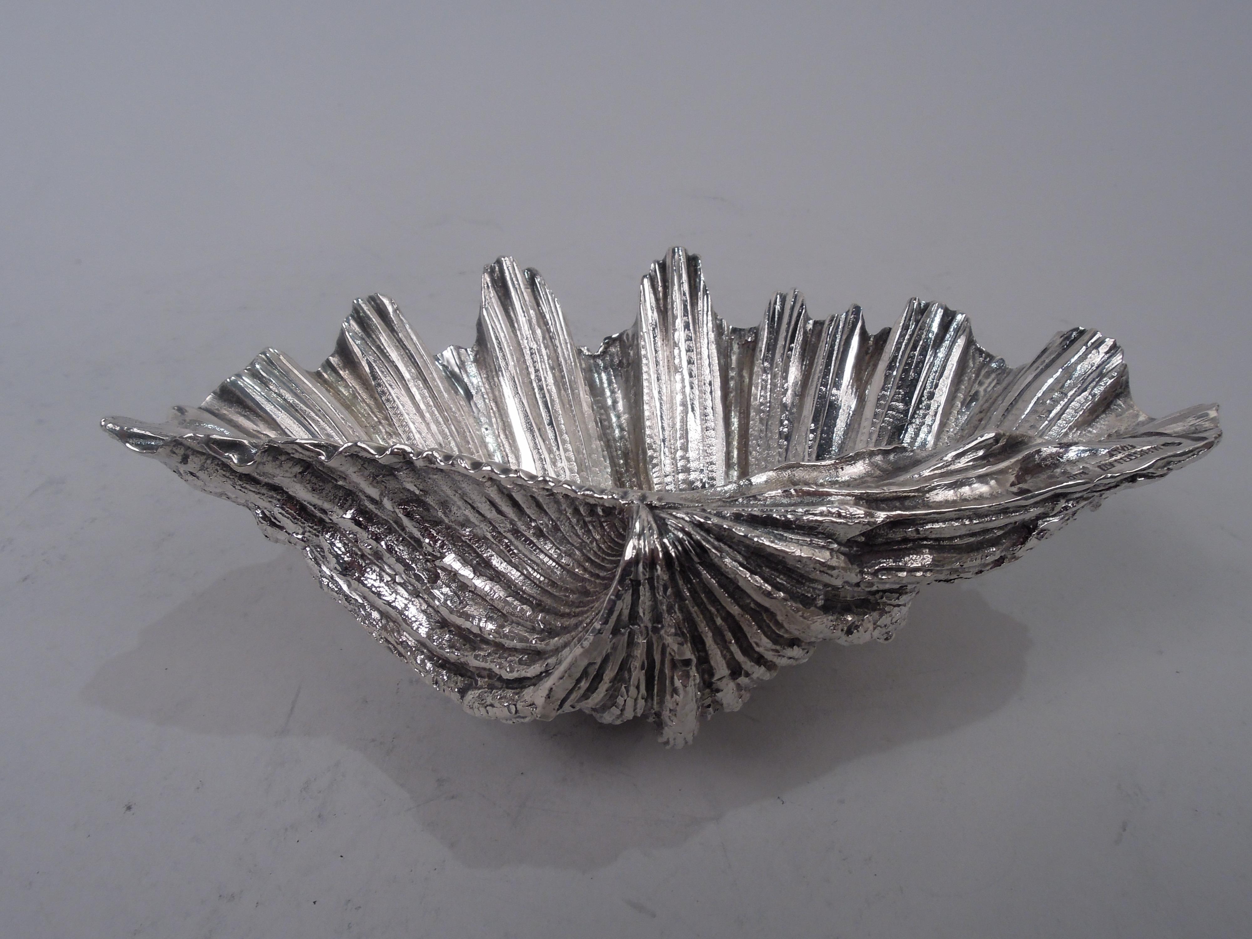 Midcentury Classical silver dish. Cast seashell with striations and irregularities; bottom encrusted with two conch supports. Realistic marine life wrought in precious metal. Marks include 1944-1968 maker’s stamp, 800 fineness stamp, and phrase “M.