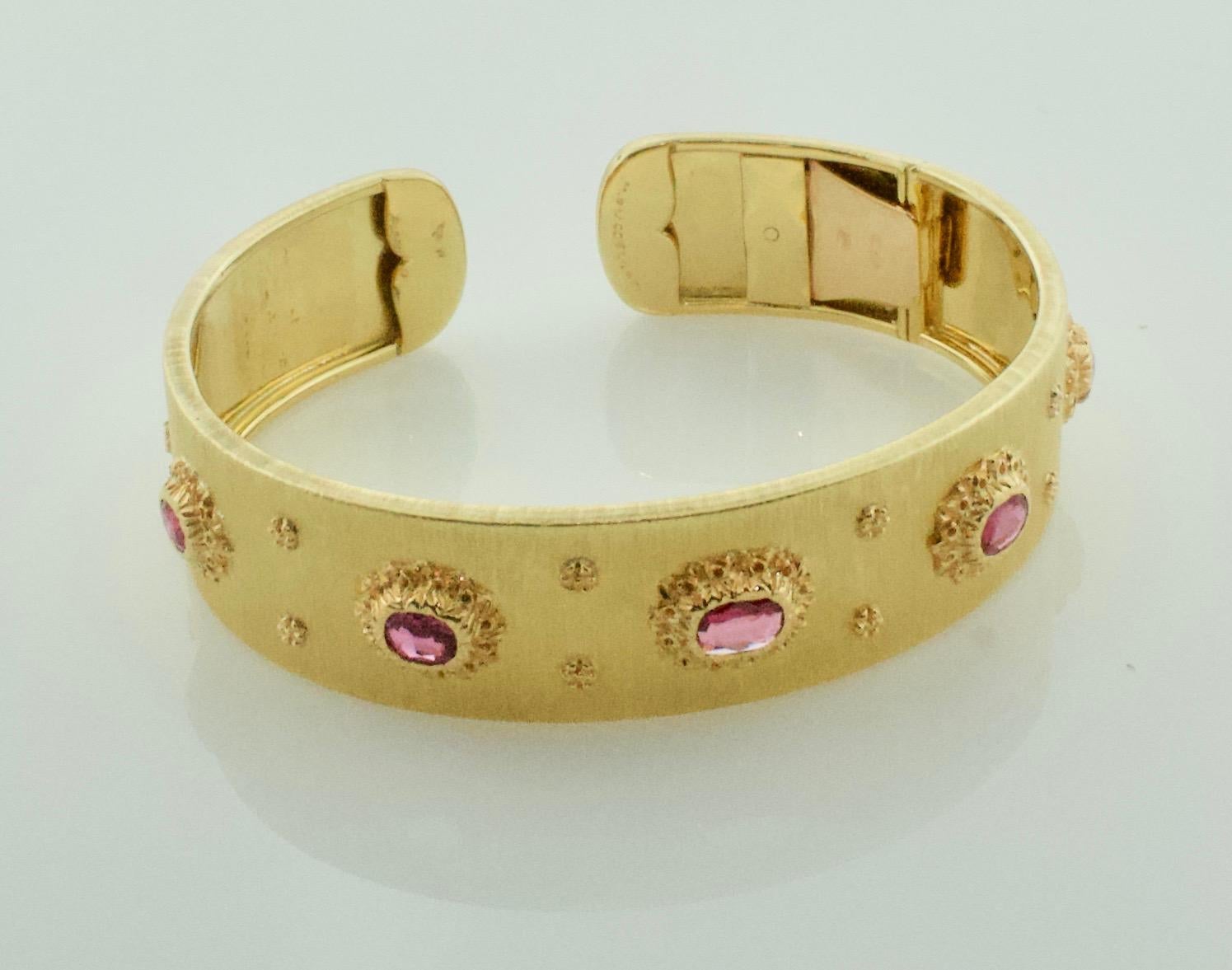 Mario Buccellati Ruby Bangle Bracelet in 18k Yellow Gold
Five Oval Cut Rubies Weighing 2.00 carats approximately   
Opens with Spring Latch For Easy Wearing
Purchased From a Renowned Hollywood Movie Family

In 1919 Mario Buccellati opened his first