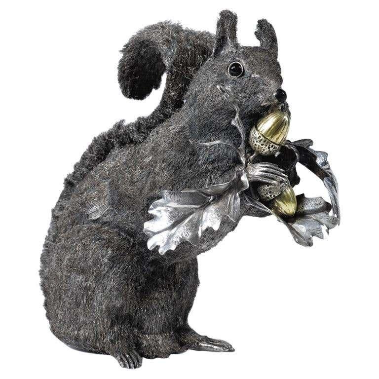 Mario Buccellati Silver Squirrel, silver texted fur with glass eyes, enamel nose and gilt acorns.
Signed on one leaf Mario Buccellati, 925, and 15-MI
Measurements: 
height 7? in. 
684 grams
22 OZ.



 