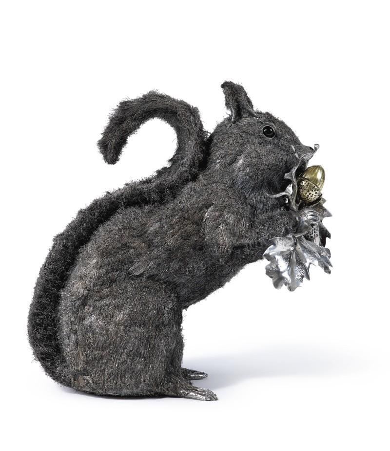 Mario Buccellati Silver Squirrel, silver texted fur with glass eyes, enamel nose and gilt acorns.
Signed on one leaf Mario Buccellati, 925, and 15-MI
Measurements:   
height 7⅞ in.  
684 grams
22 OZ



