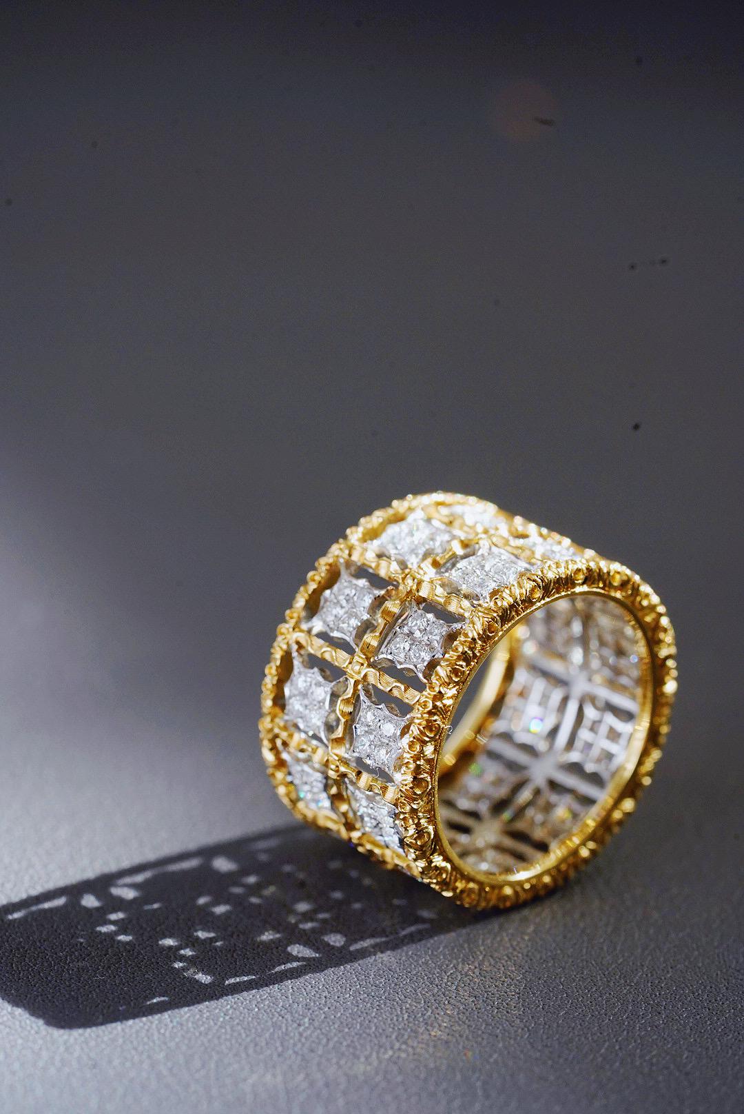 Mario Buccellati exemplifies the highest level of Italian craftsmanship and this vintage diamond band ring is of unsurpassed aesthetic beauty and classic distinction. It is crafted in fine 18K yellow gold with white gold.

Having been inspired by