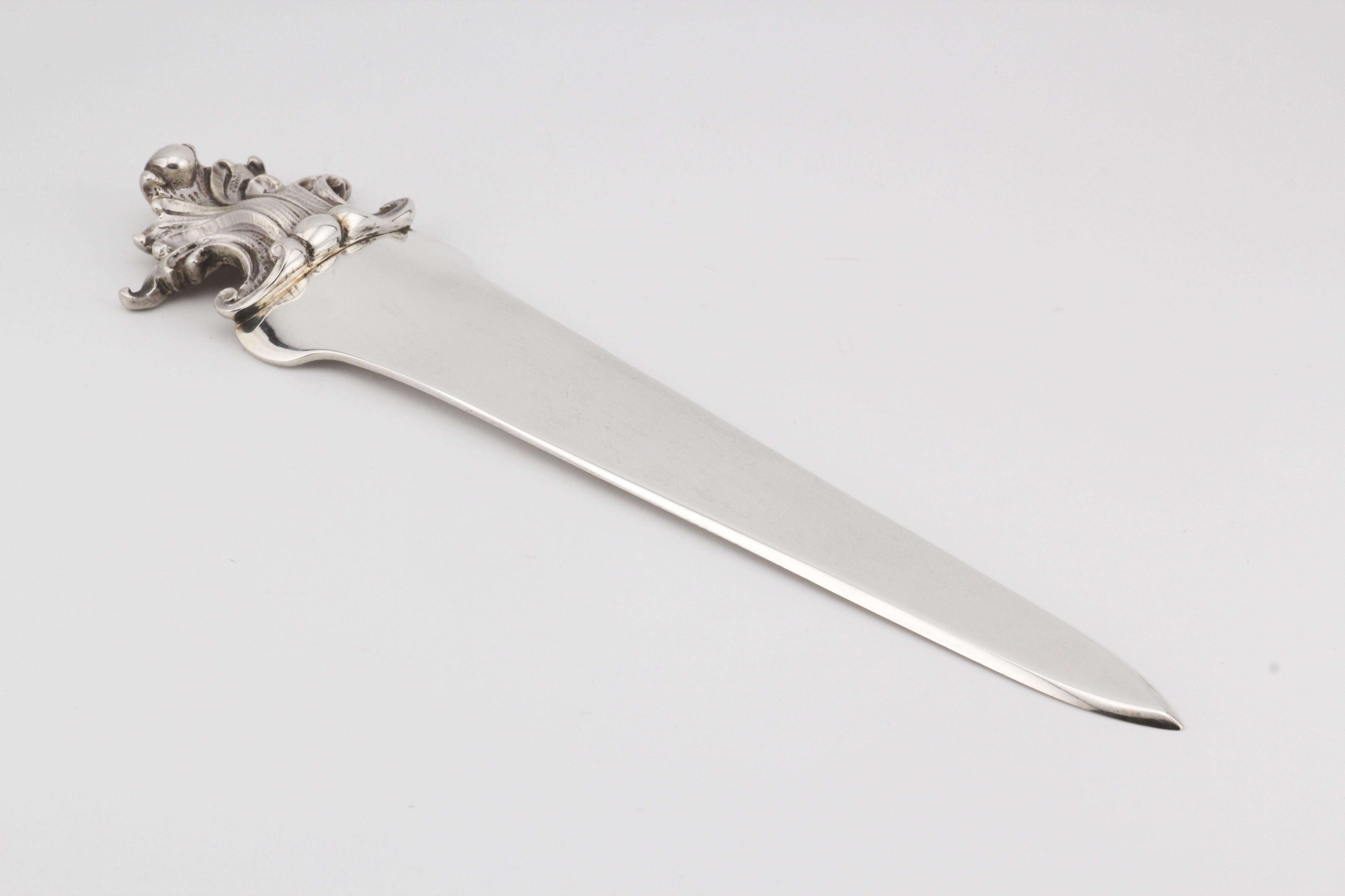 The Buccellati Sterling Silver Letter Opener is a testament to exquisite craftsmanship and elegant design. This refined piece is crafted from sterling silver, showcasing a beautifully ornate handle that adds a touch of sophistication and artistry to