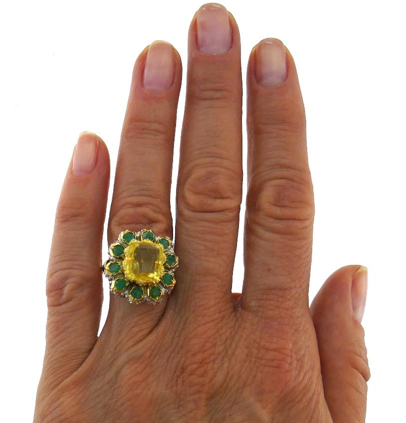 Magnificent cocktail ring created by Mario Buccellati in Italy in the 1950s. 
Features an approximately 4.70-carat cushion cut yellow sapphire (10.46 x 9.28 x 5.15 mm) tastefully set in white gold and yellow gold setting and framed with ten round