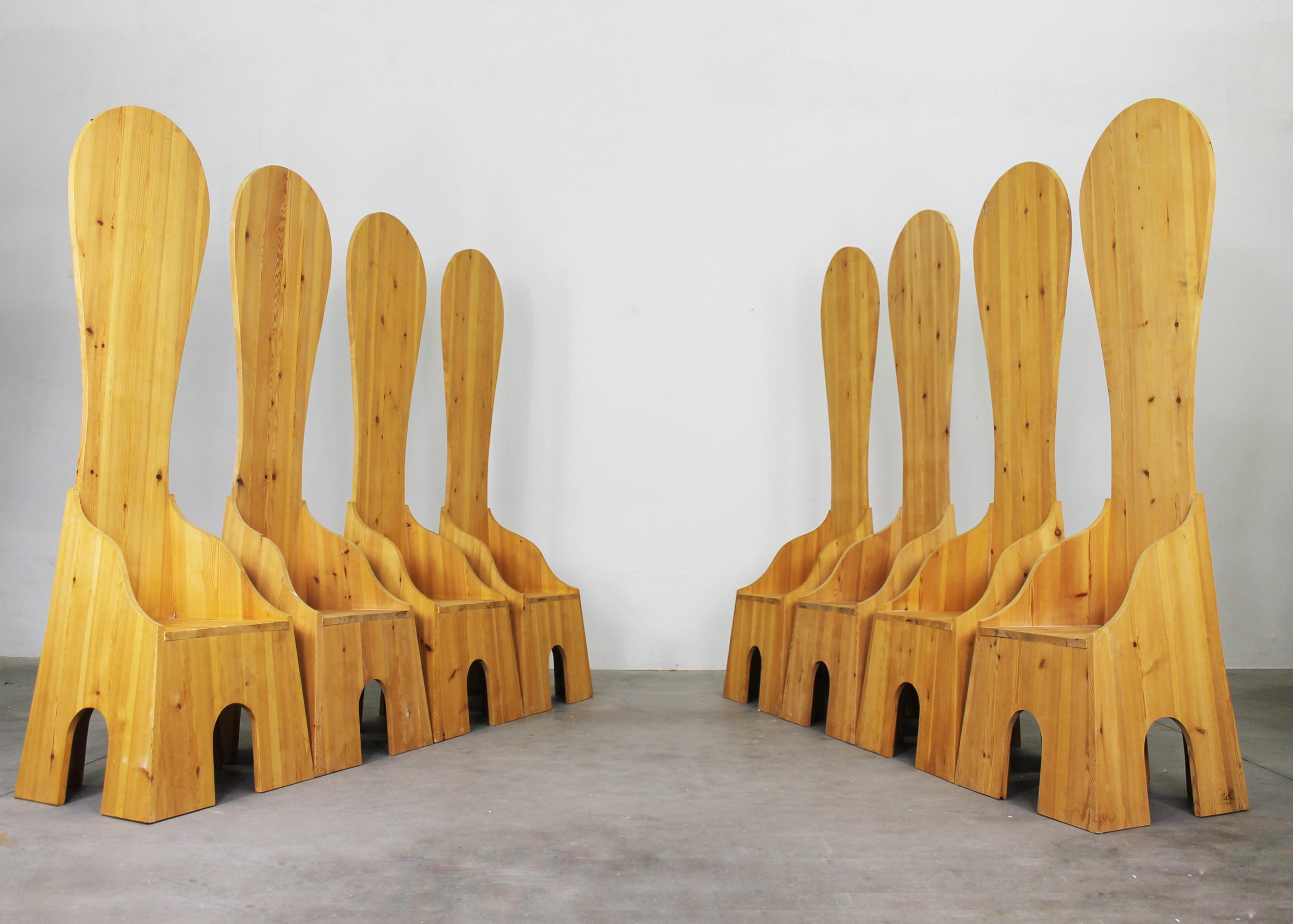 Set of eight Fratina chairs in pine wood designed by Mario Ceroli in 1972 and produced by Poltronova. 

Mario Ceroli showed this chair for the first time during the Shakespearean piece of Richard III created by Luca Ronconi of which Mario Ceroli