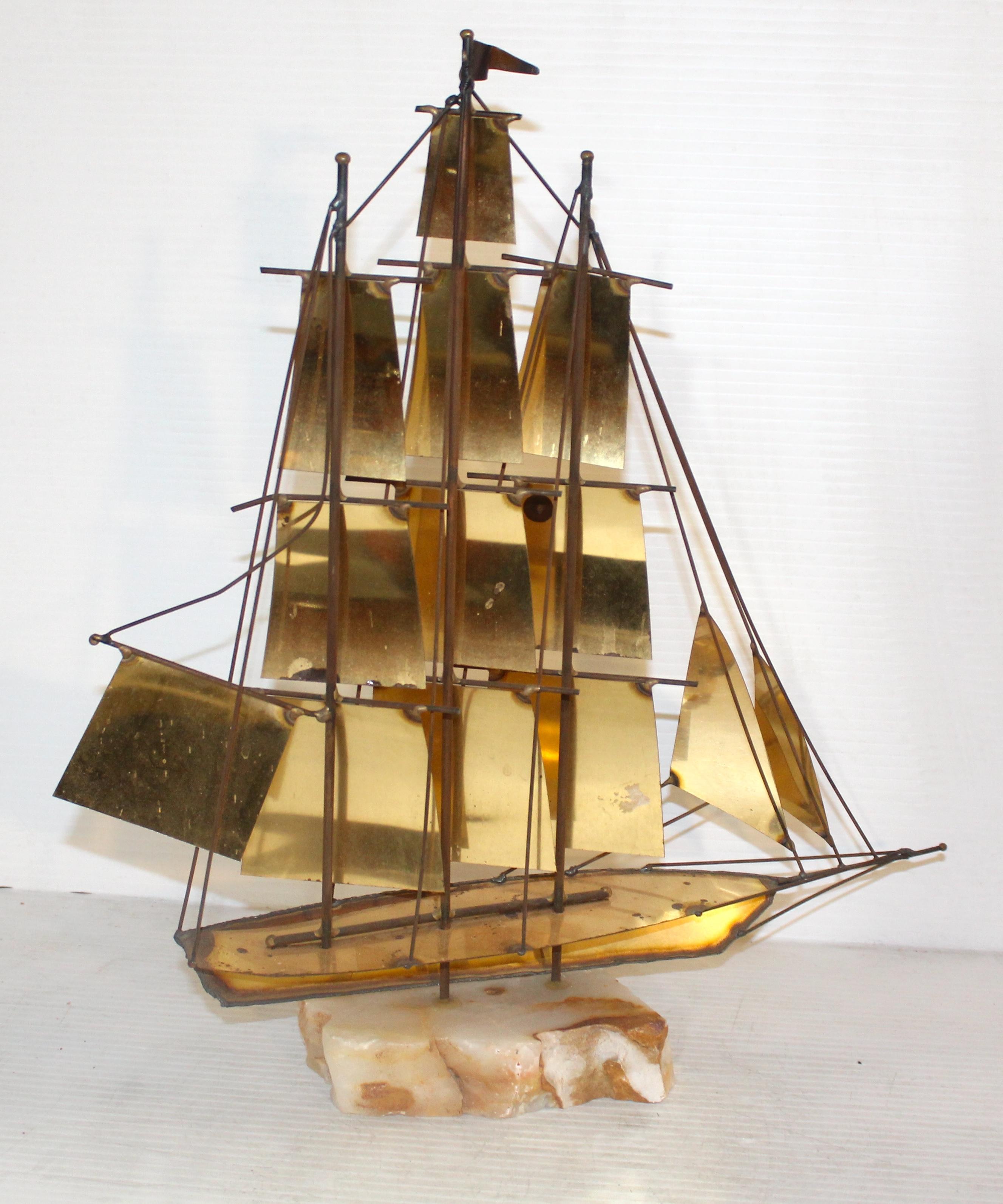 Clipper ship sculpture made of welded brass sheets. Signed by artist Mario Jason and set on an onyx base.
Please confirm location NY or NJ
