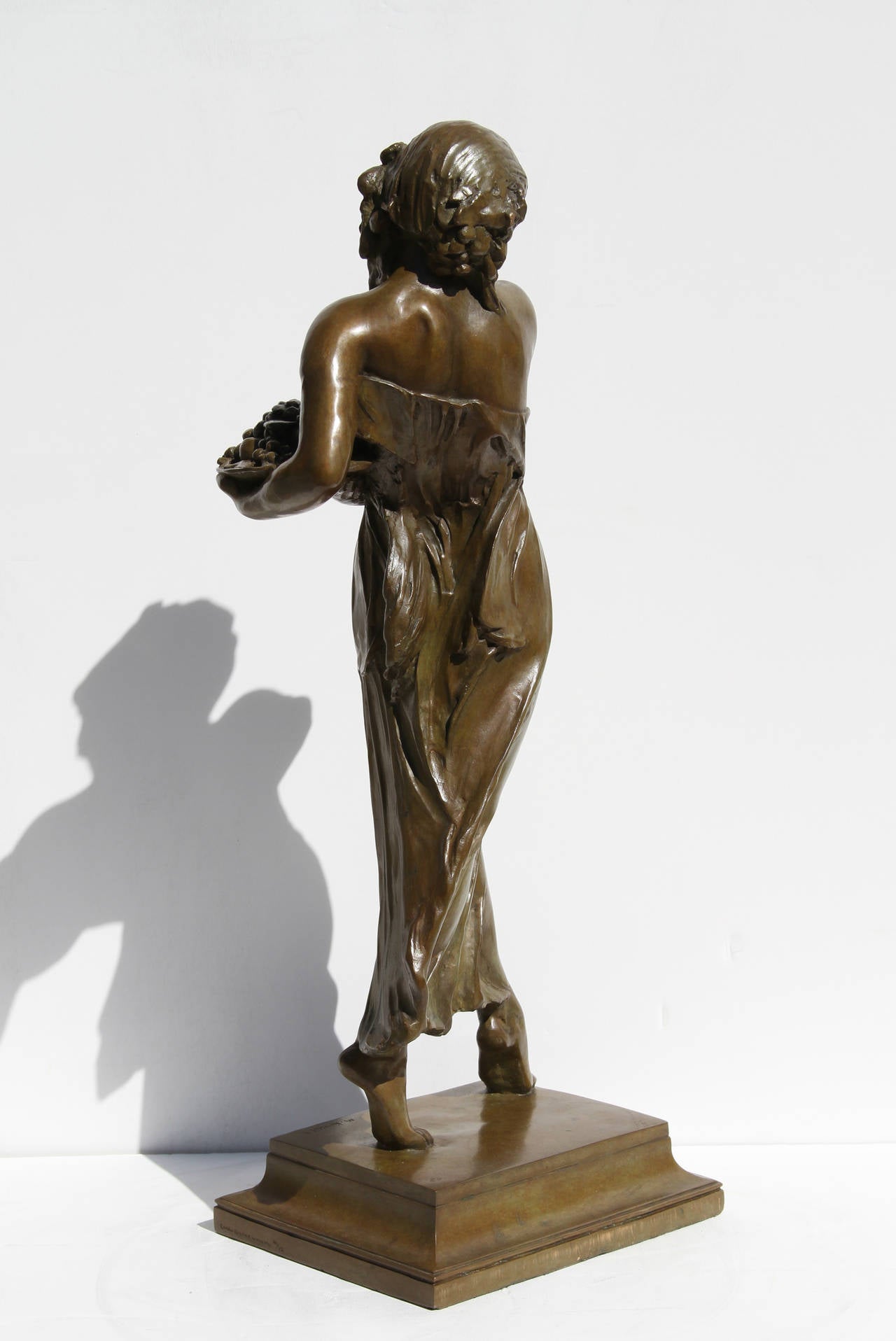 This bronze sculpture by Mario Joseph Korbel is a stunning portrayal of a woman in the Romanticist style.  Korbel began studying sculpture in his homeland of Czech Republic, and continued his studies after moving to the United States at age 18. He