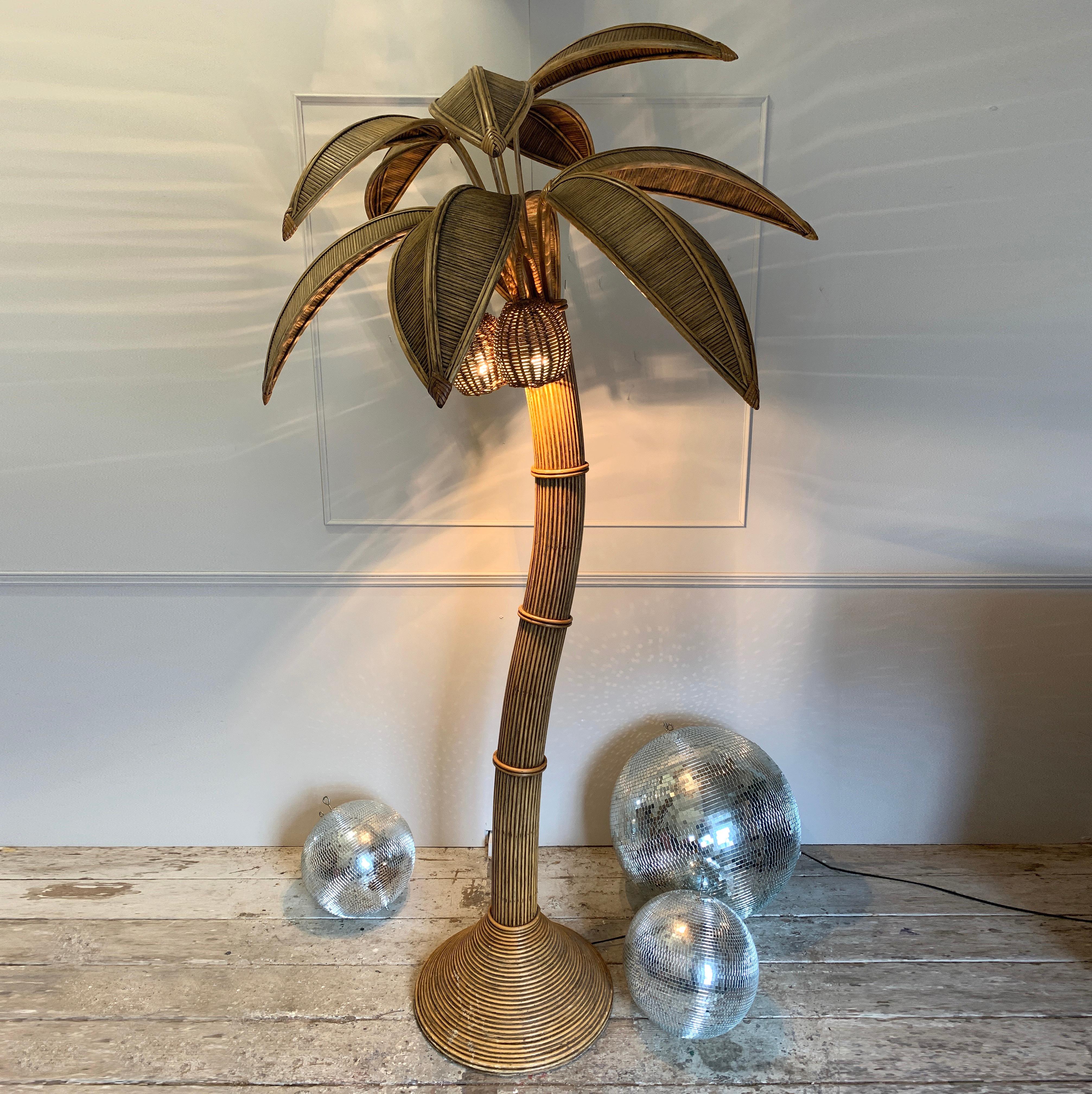 Mid Century Rattan Palm Tree Floor Lamp
In The Style Of Mario Lopez Torres
Large Rattan Palm Tree Floor Light
There Are 3 Bulbs Hidden In The Coconuts
France 1970’S
There Are 10 Leaves, 5 Large, 5 Smaller. These Are Removable And