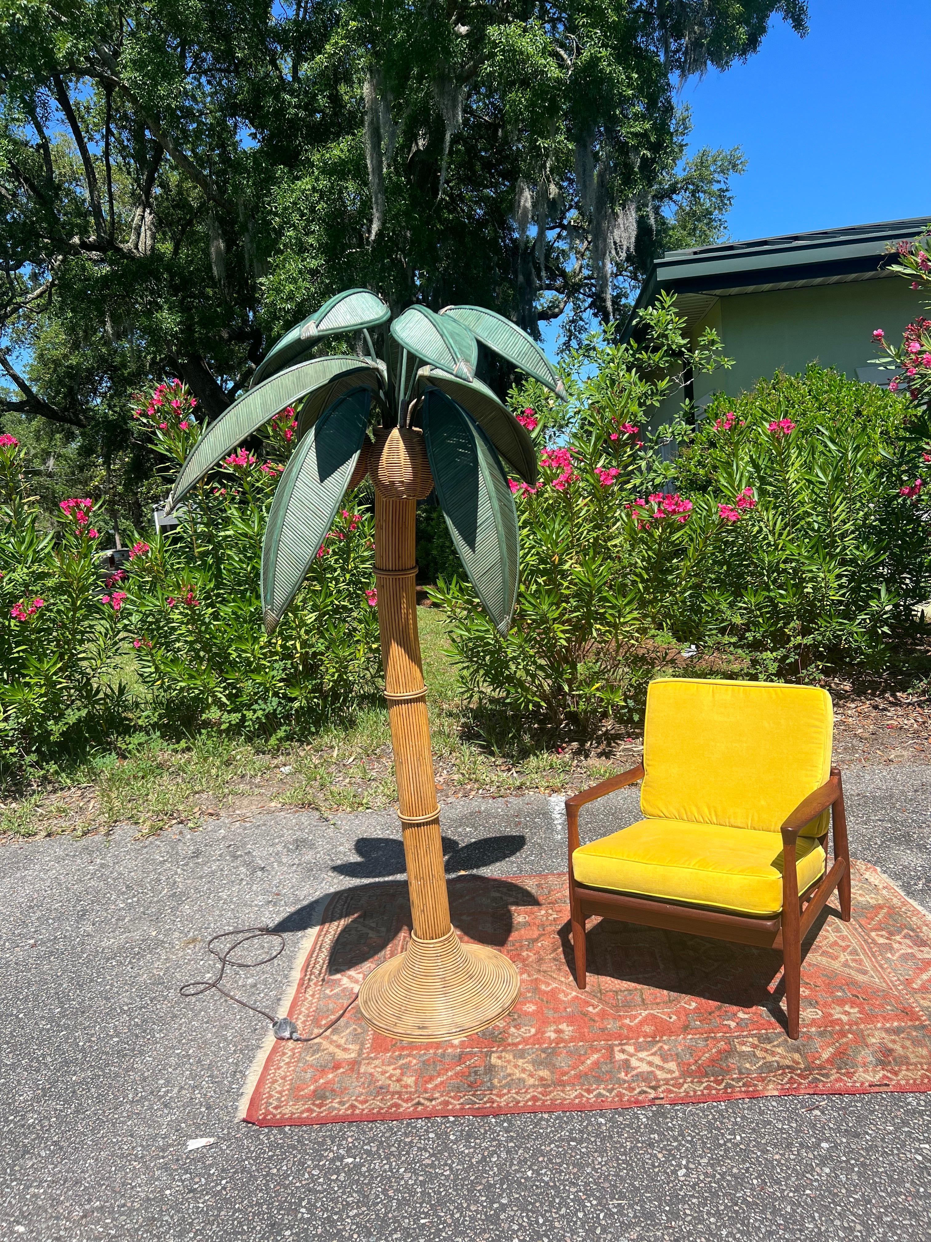 Beachy floor lamp of a Palm tree, but what I love is seeing a piece like this in a non beachy or coastal setting. Every room needs a wildcard and this is it. Just under 7 feet tall. Made of rattan and wicker. Three wicker coconuts each contain a