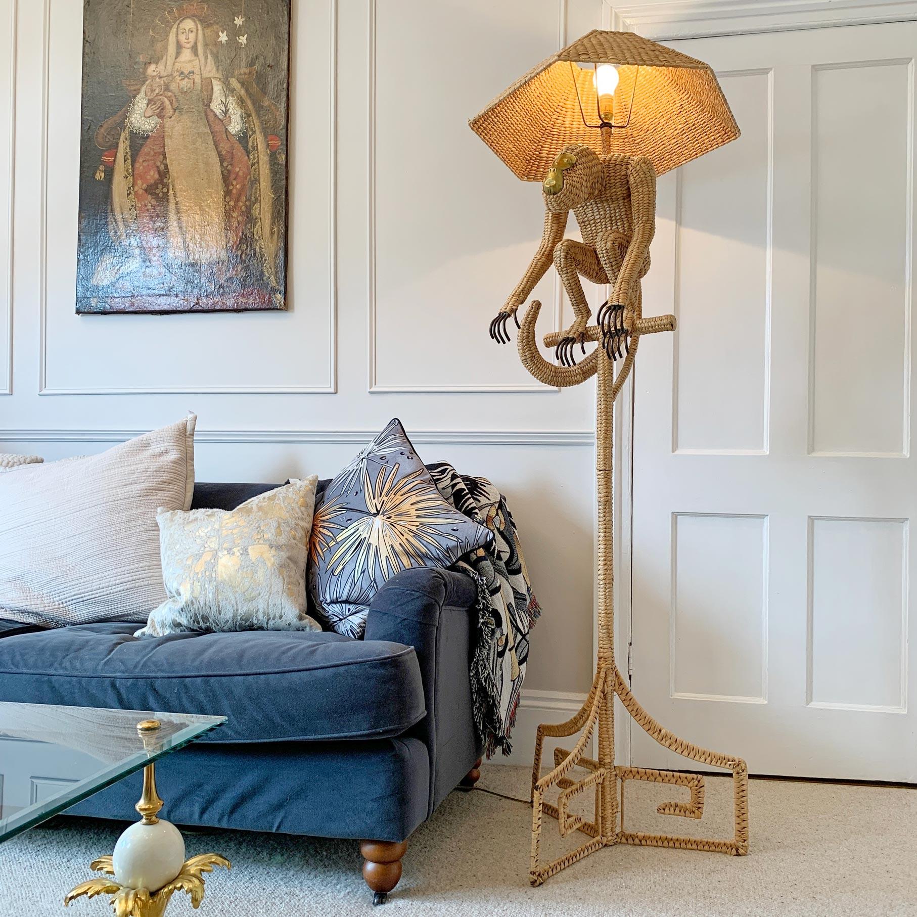 A quite exceptional floor lamp by the highly acclaimed Mexican artist and sculptor Mario Lopez Torres, the enormous metal frame and chuspata woven design stands at over 1.8 Metres tall and features the large perched monkey, with the trademark brass