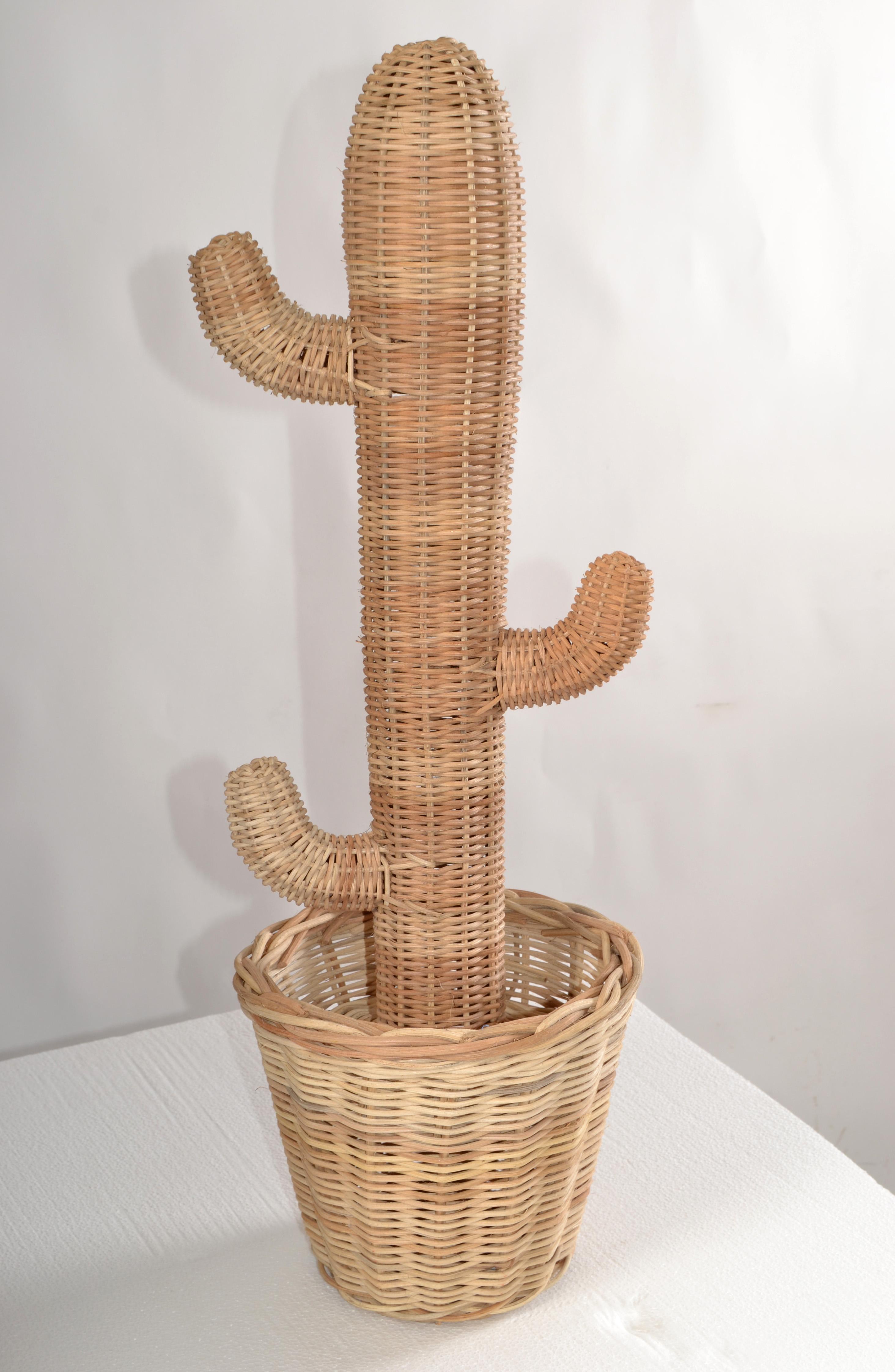 Mario Lopez Torres Style Mid-Century Modern hand-woven Rattan, Wicker and Reed Cactus Pot Sculpture.
Bohemian Style made in America in the late 20th Century.
All original condition with some breaks at the Stem due to age and dryness.