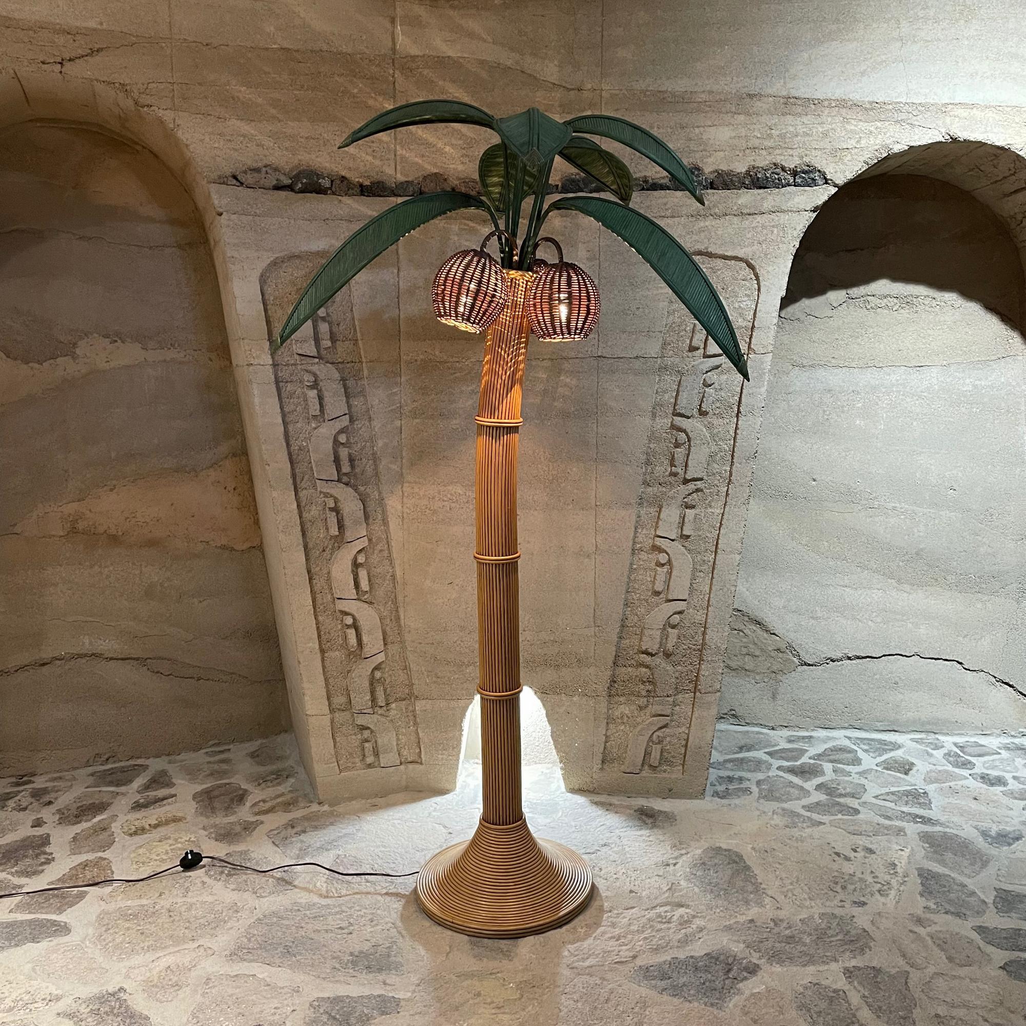 Floor Lamp
1970s Vintage Stunning Exotic and Majestic Tall Palm Tree Floor Lamp in handmade rattan and wicker with dyed green wicker branches.
In the style of designer and Mexican folk artist, Mario Lopez Torres. Unmarked.
Evokes tropical delight in