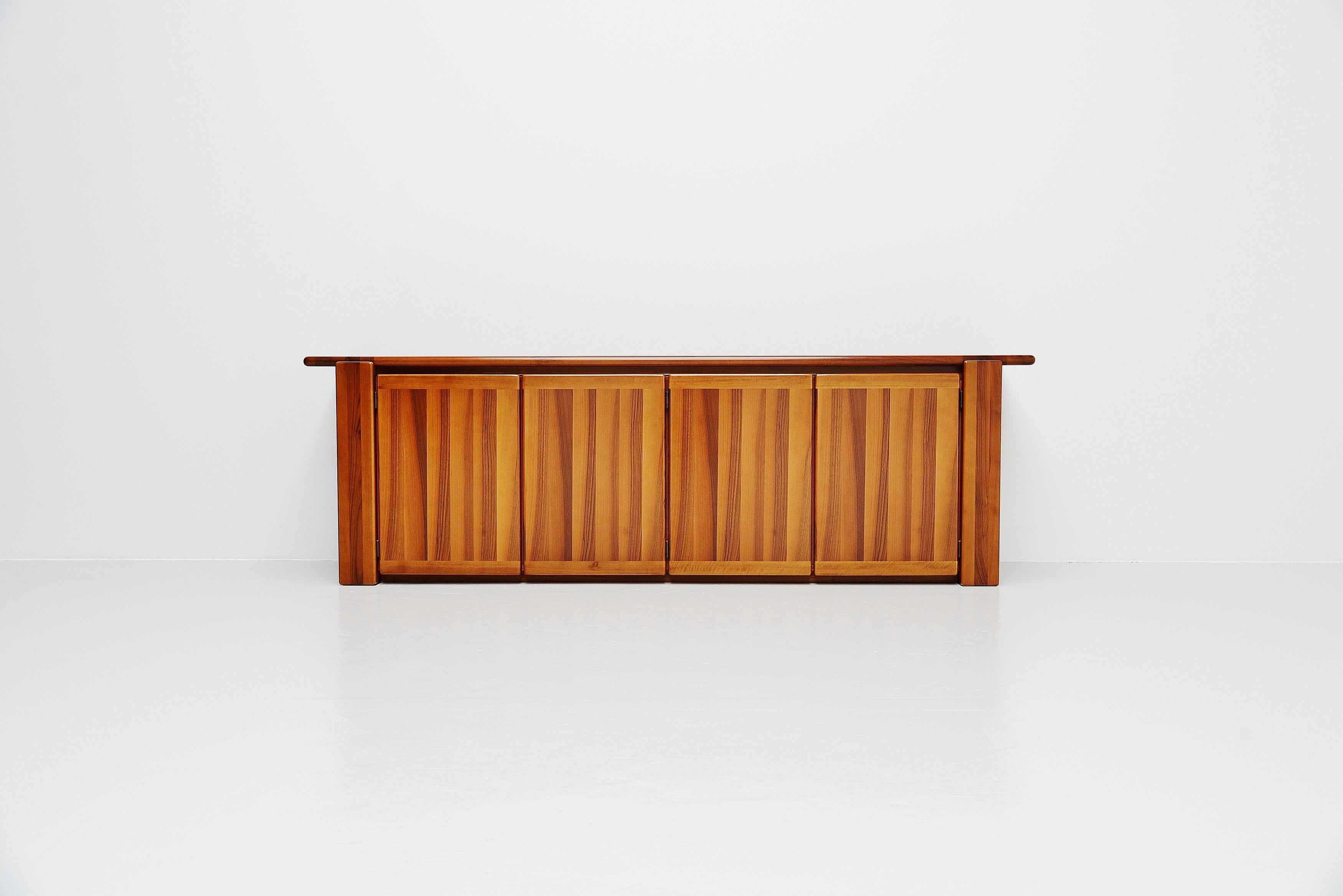Geometric layered large 'Saporro' credenza designed by Mario Marenco and manufactured by Mobilgirgi, Italy, 1978. This credenza is made of stunning grained walnut veneer and solid walnut parts. The credenza has a geometric look because of the