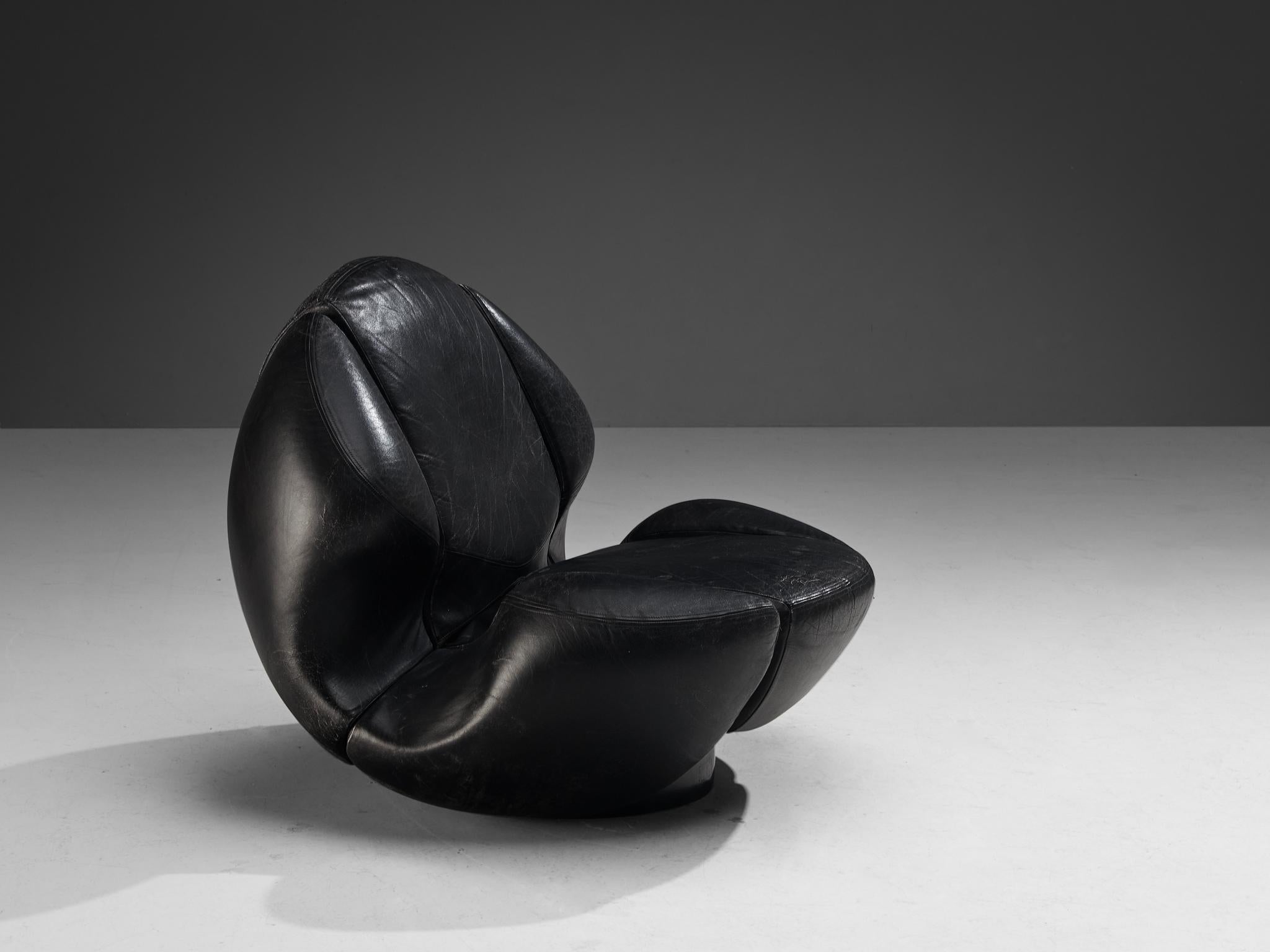 Mario Marenco for Comfortline, lounge chair, leather, molded polyurethane, Italy, 1980s

A postmodern club chair created by the Italian designer and actor Mario Marenco (1933-2019). With a rather unconvential form, this piece is a sculpture in