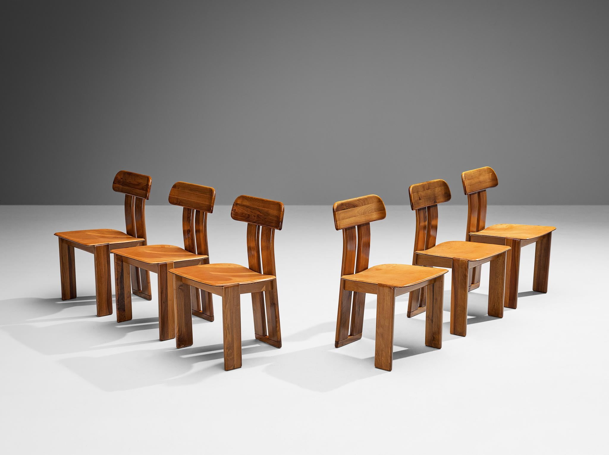 Mario Marenco for Mobil Girgi, set of six dining chairs model ‘Sapporo’, walnut, brown leather, Italy, 1970s

Beautiful set of six dining chairs in walnut and brown leather designed by Mario Marenco in the 1970s. These chairs feature wonderful