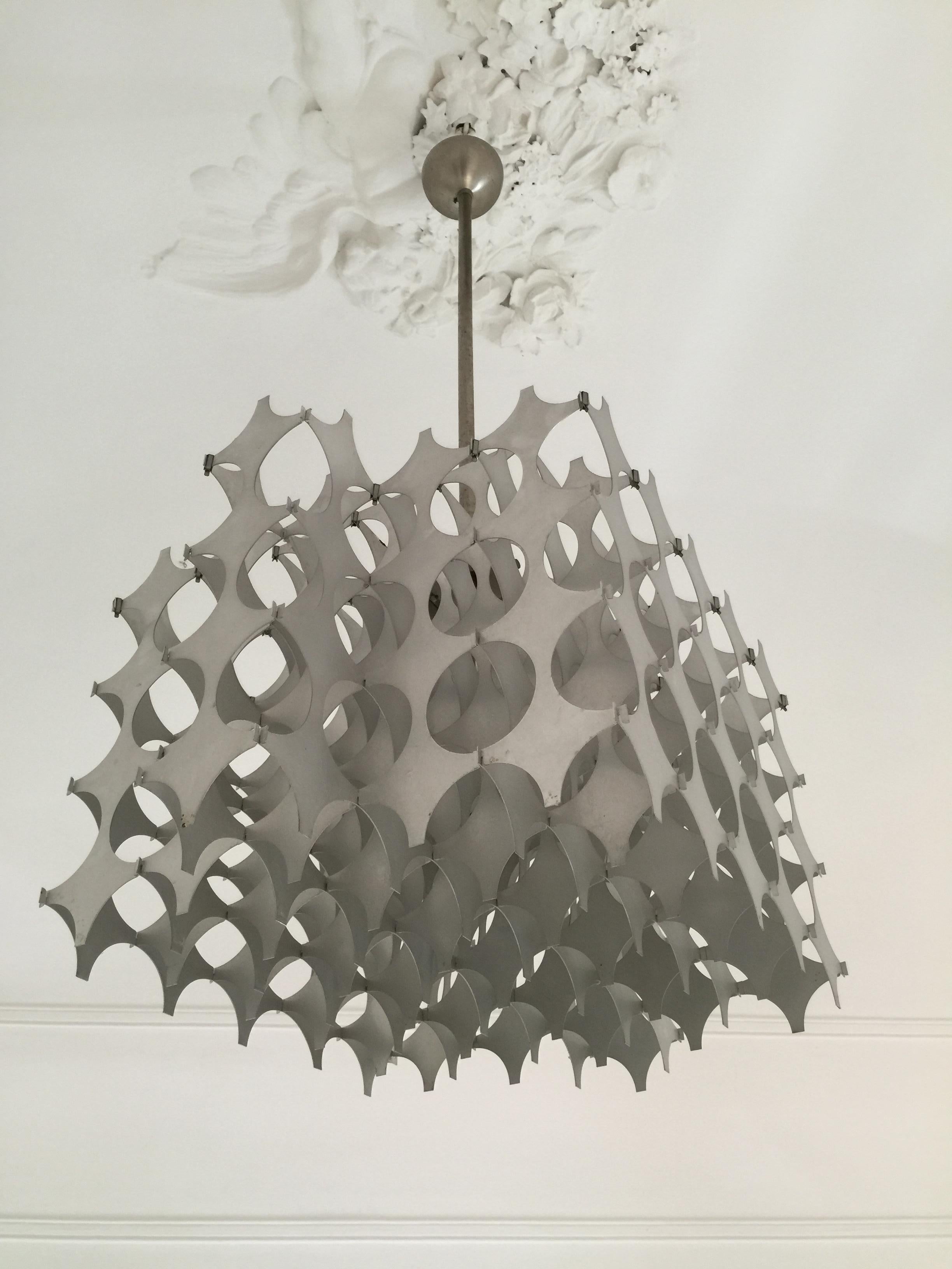 This midcentury chandelier was designed by Mario Marenco for Artemide in Italy and it is made of brushed aluminium.