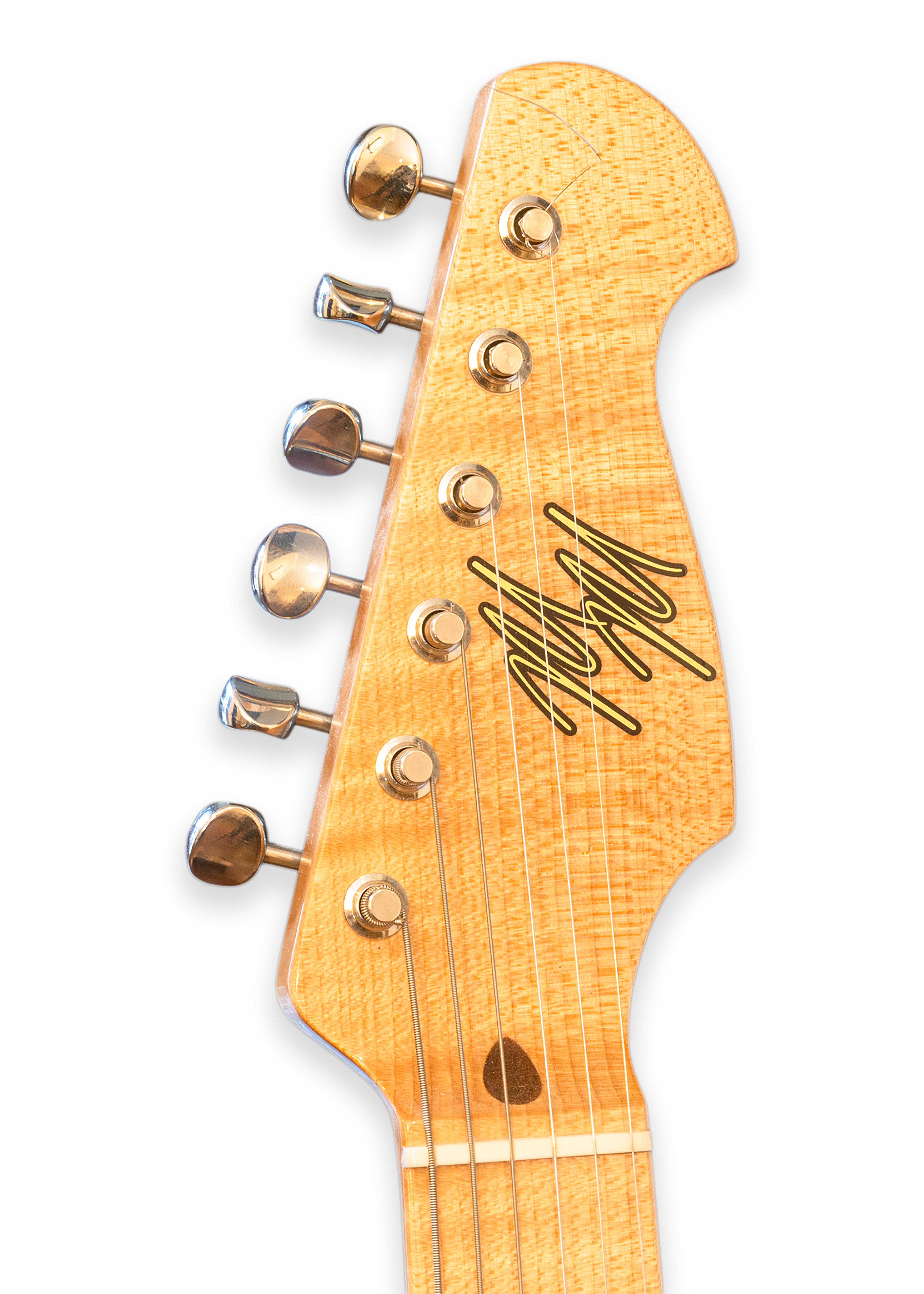 Handcrafted by renowned luthier Mario Martin, this T-style electric guitar exemplifies Martin's reputation for boutique-quality instruments that blend vintage-inspired design with modern playability. Featuring a natural finish ash body with a black