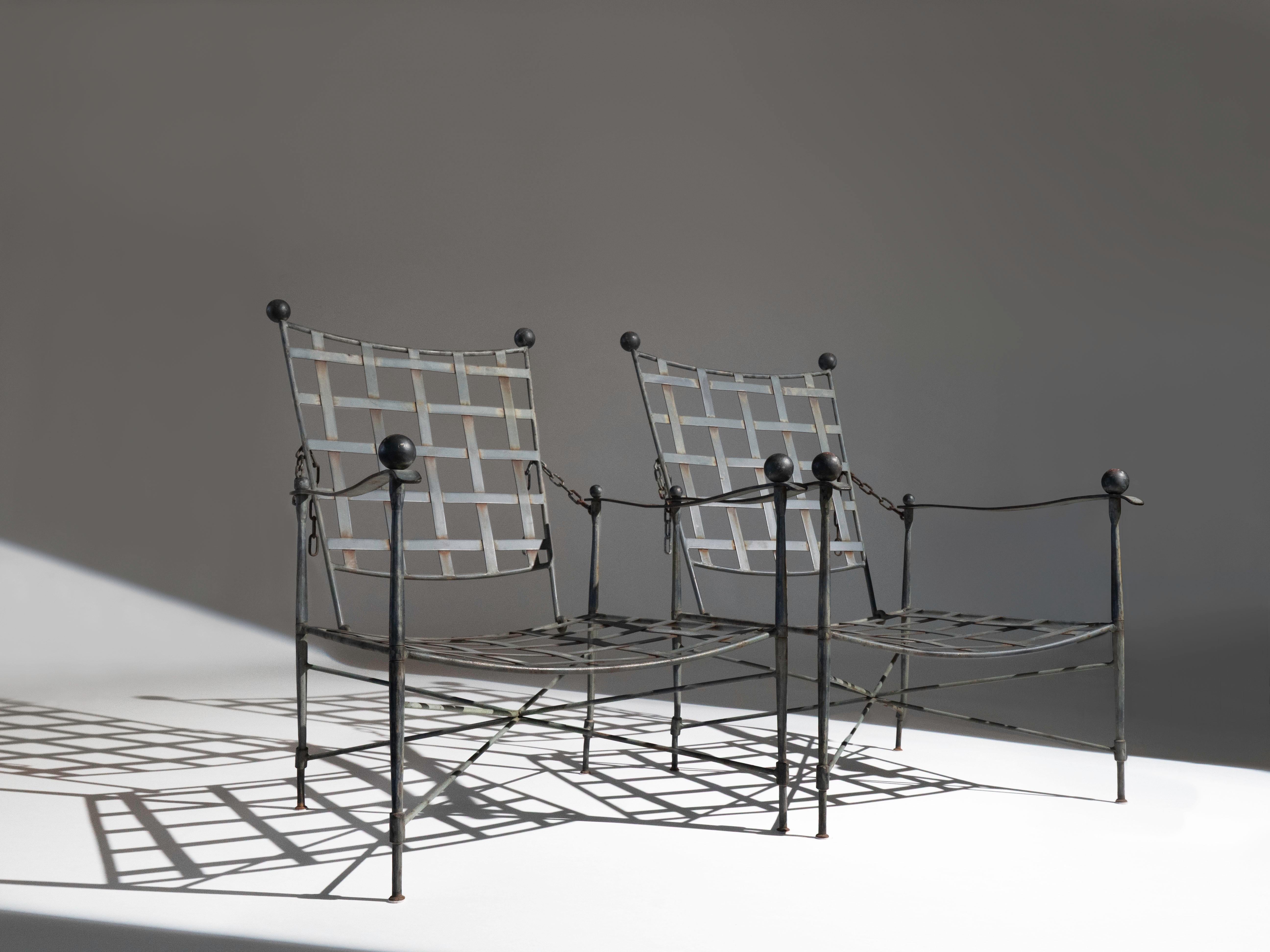 A pair of wrought iron lounge chairs by designer Mario Papperzini for John Salterini.  Manufactured circa 1950's.  This line of furniture was named 