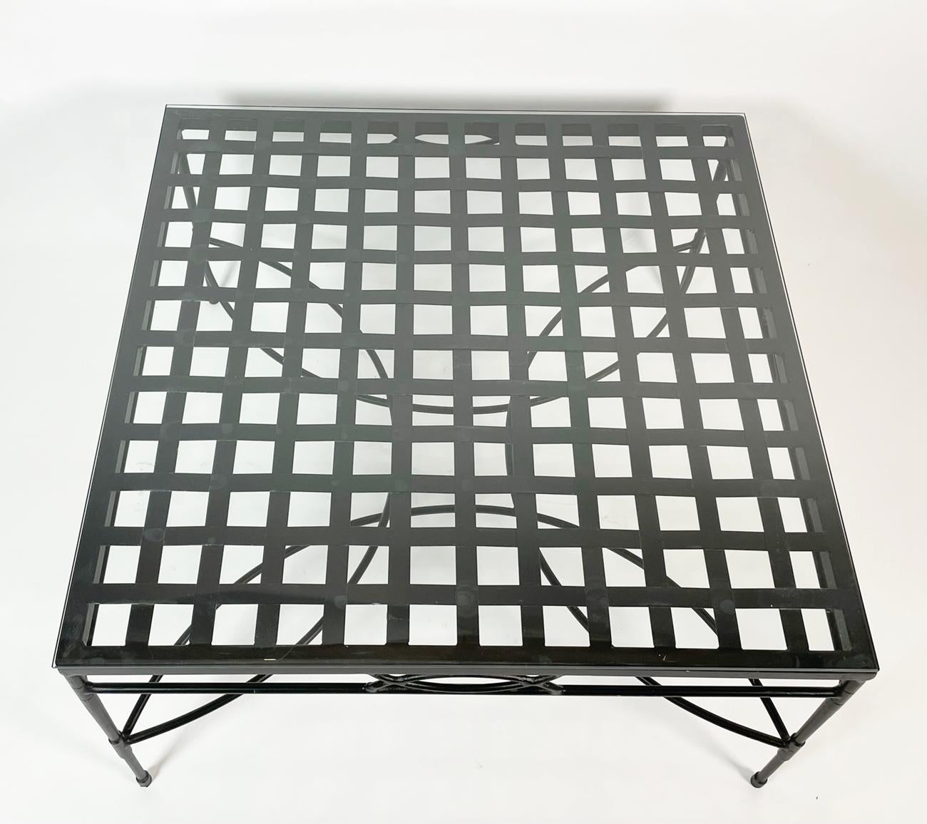 Introducing the Mario Papperzini Coffee Table with a Glass Top - the perfect addition to any modern living space.

 This stunning piece of furniture boasts a sleek steel ornate base and a lattice design top that is sure to complement any home decor.