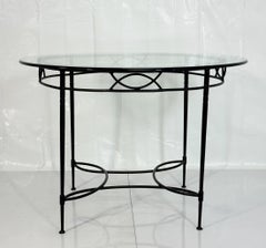 Mario Papperzini para Janus et Cie: mesa de comedor redonda de hierro y cristal
