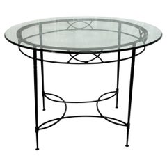 Mario Papperzini para Janus et Cie: mesa de comedor redonda de hierro y cristal