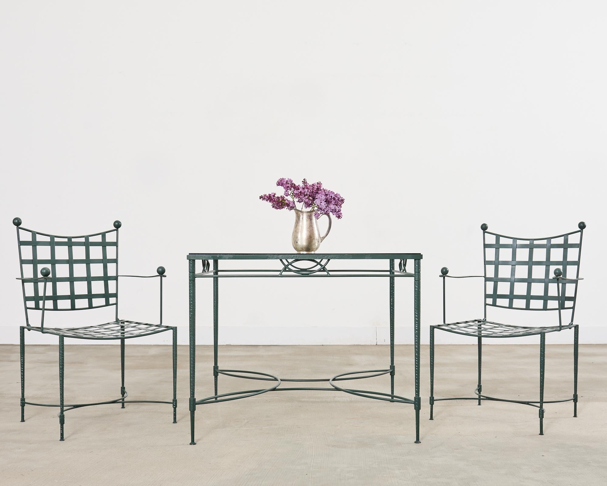 Iconic patio and garden mid-century dining suite designed by Mario Papperzini for John Salterini. The rare set consists of four dining armchairs and one dining table square shaped. The legs of the chairs and table all feature the authentic