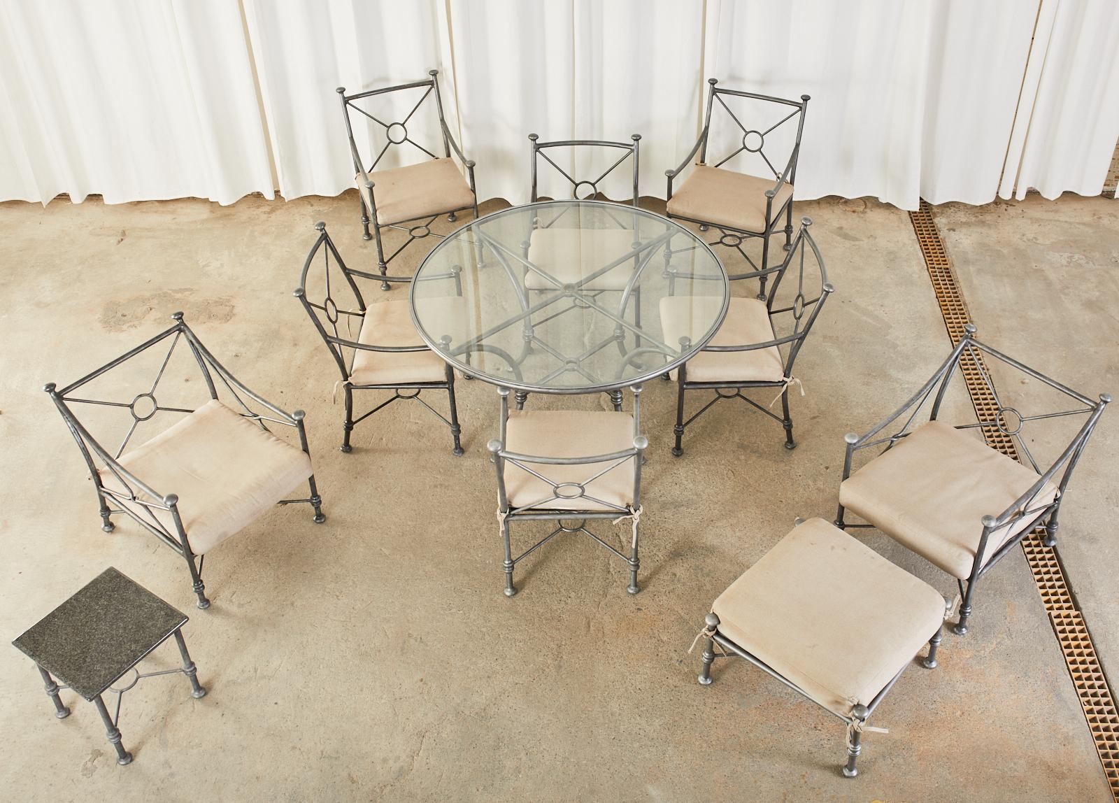 Grand eleven piece set of cast aluminum garden dining patio furniture suite. The large matching set includes six dining armchairs, two lounge chairs with one ottoman, one granite top drinks table, and one round glass dining table. Crafted in the
