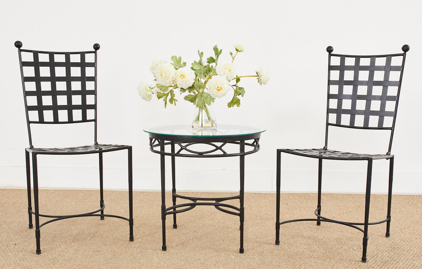 Stylish black iron patio and garden drink table made in the style and manner of Mario Papperzini for John Salterini. Iconic mid-century modern design attributed to Janus et Cie from their Amalfi collection. The round frame has straight legs