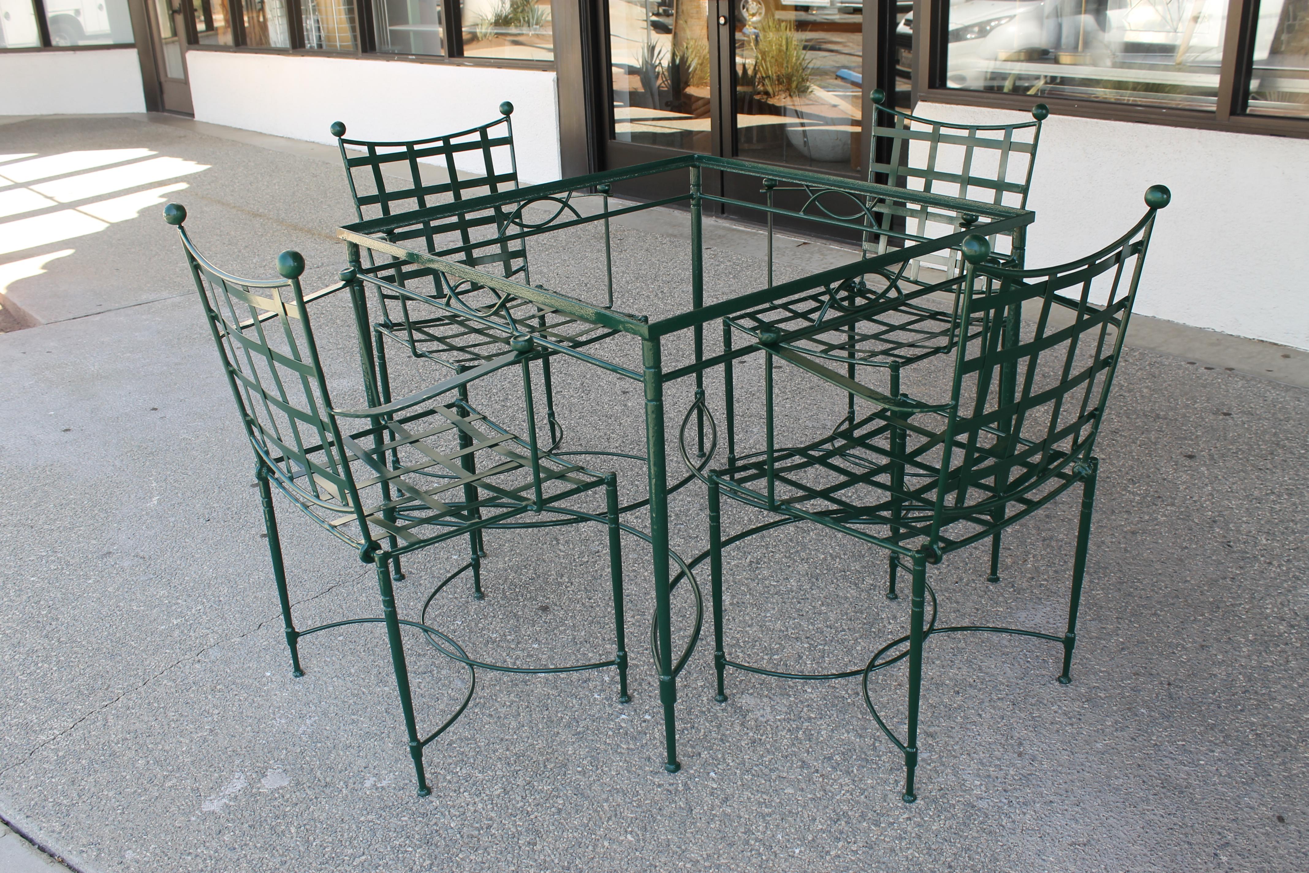 Table and four dining chairs by Mario Papperzini for Salterini. Table with glass top measures 35.5