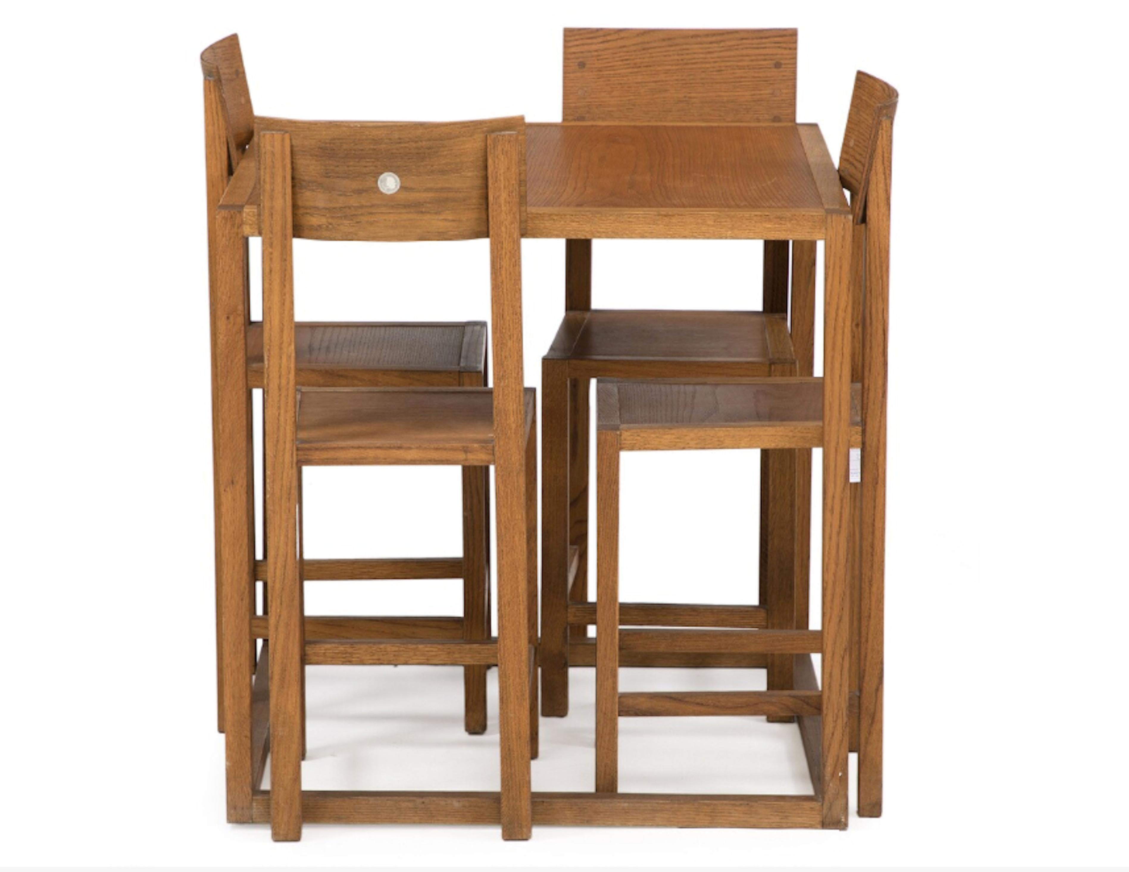 An authentic design collection set. Table and four chairs of oak. Model 