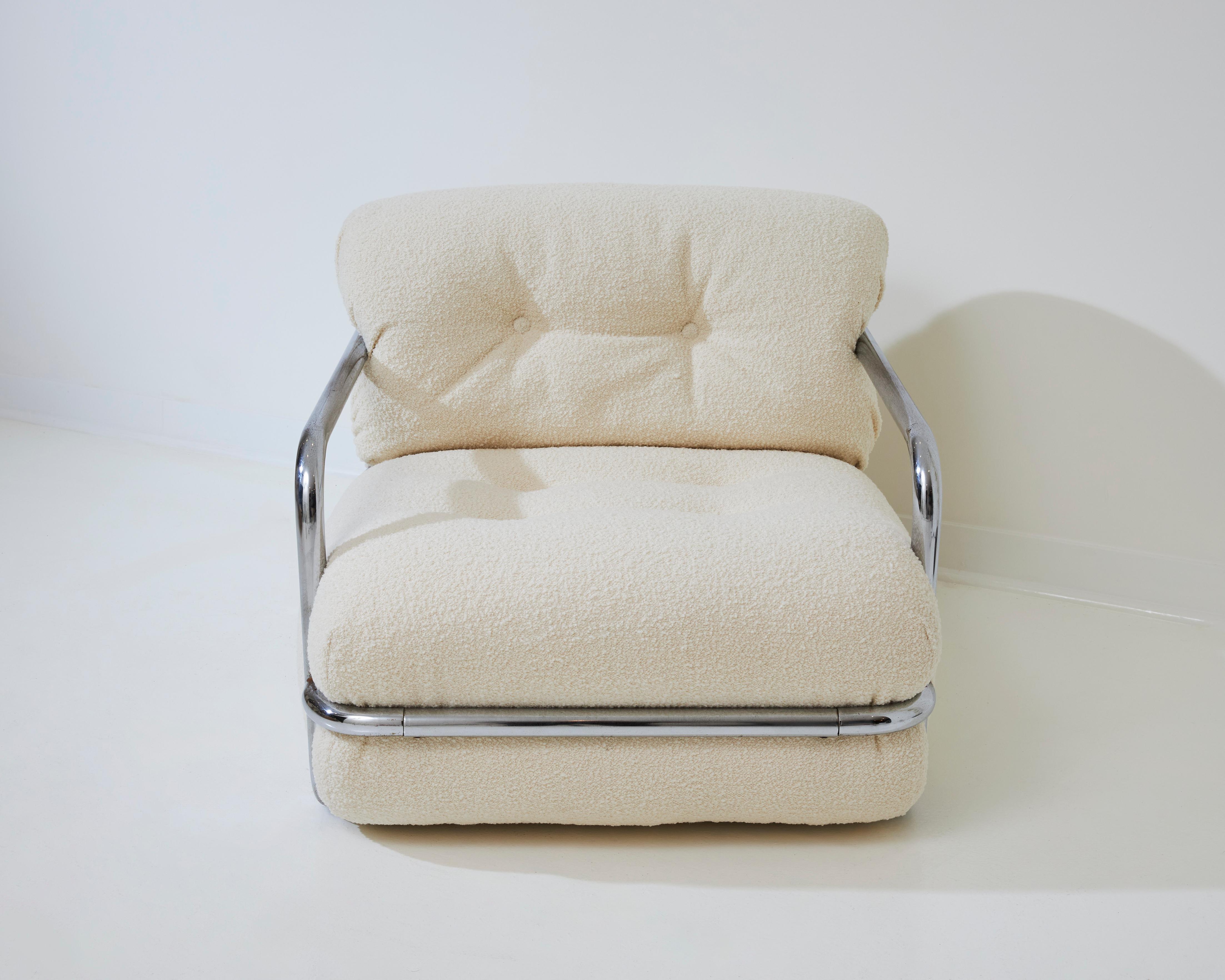 This Mario Sabot armchair was crafted in Italy in the 1970s, designed for Mario Sabot's Atelier. It has been refurbished with exquisite white bouclé wool, enhancing its beauty. The chair features a chromed metal structure, reflecting Sabot's