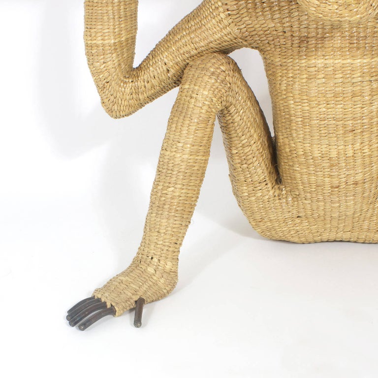 We're not monkeying around with this whimsical midcentury chimpanzee console by Mario Torres. Constructed of a metal frame wrapped with wicker and exposed fingers and toes. Capturing the playful nature of these bright primates with an amusing
