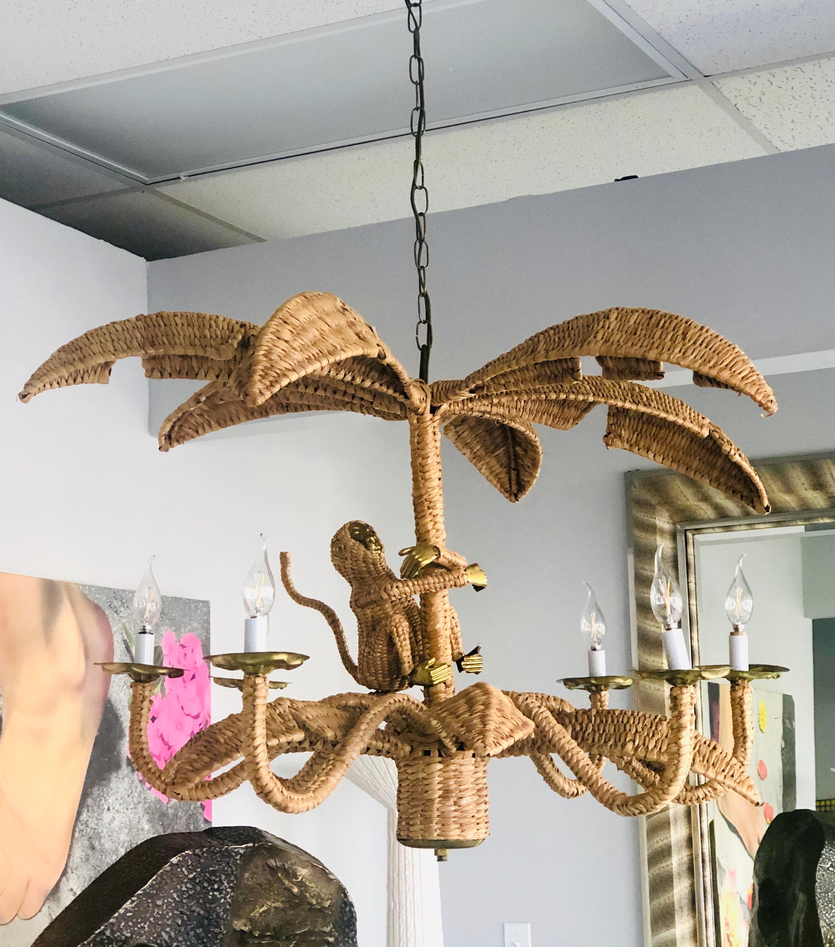A large chandelier by Mario Torres Lopez. Jute on metal frame with copper accents. 6-light and lots of charm. Comes with chain that adds 48