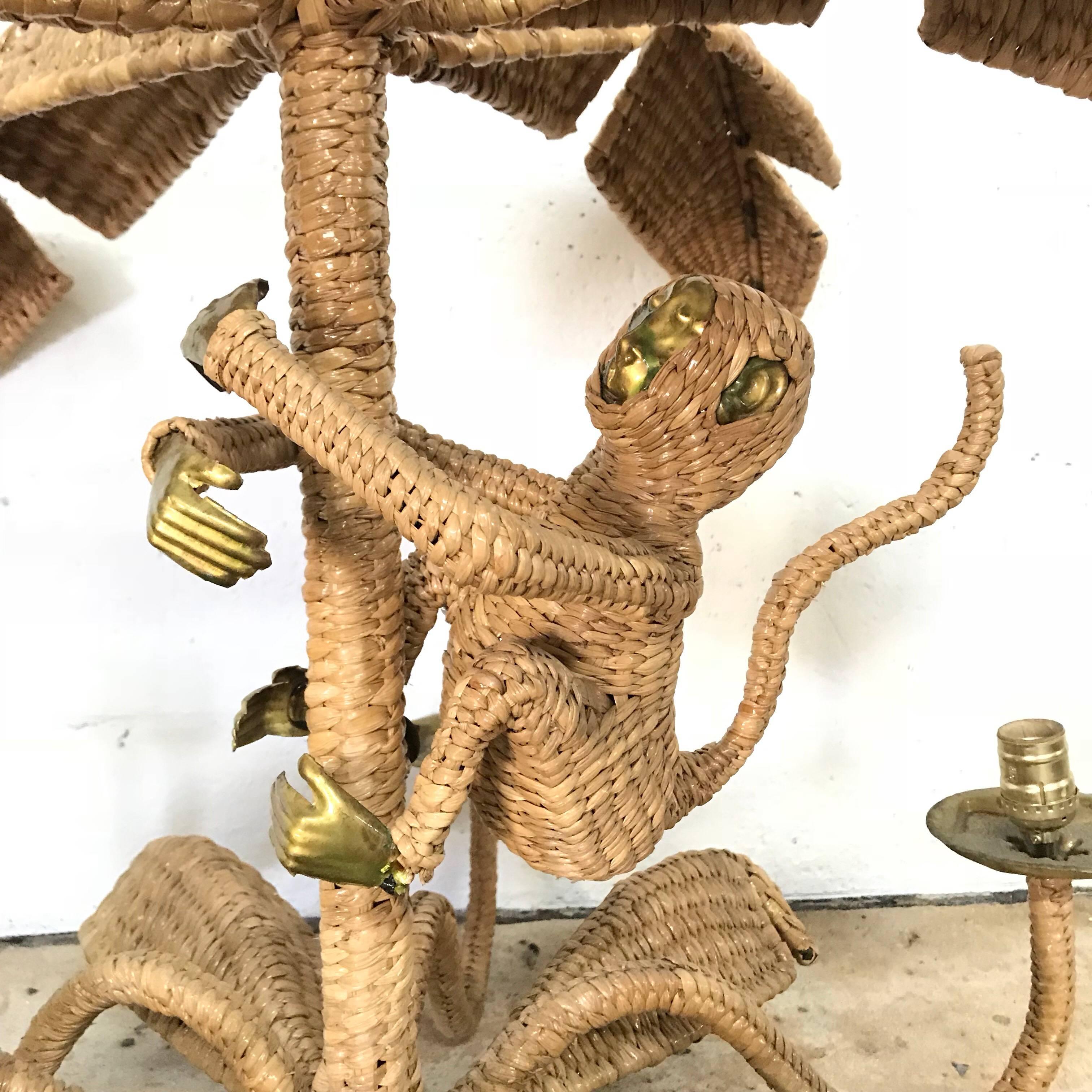 Whimsical six-light chandelier with a monkey climbing a palm tree rendered in woven wicker/reed by Mario Torres.