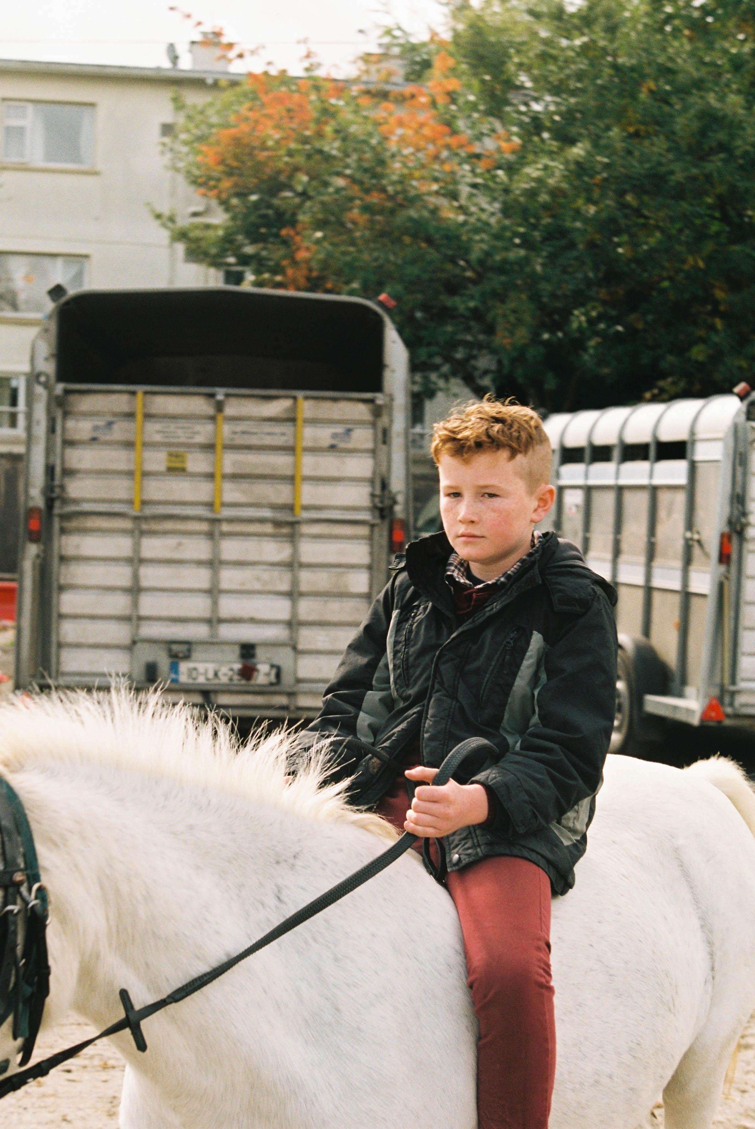 Marion Bergin Animal Print - Irish Red Haired Boy and Horse - Ballinasloe Horse Fair, Ireland, 2018