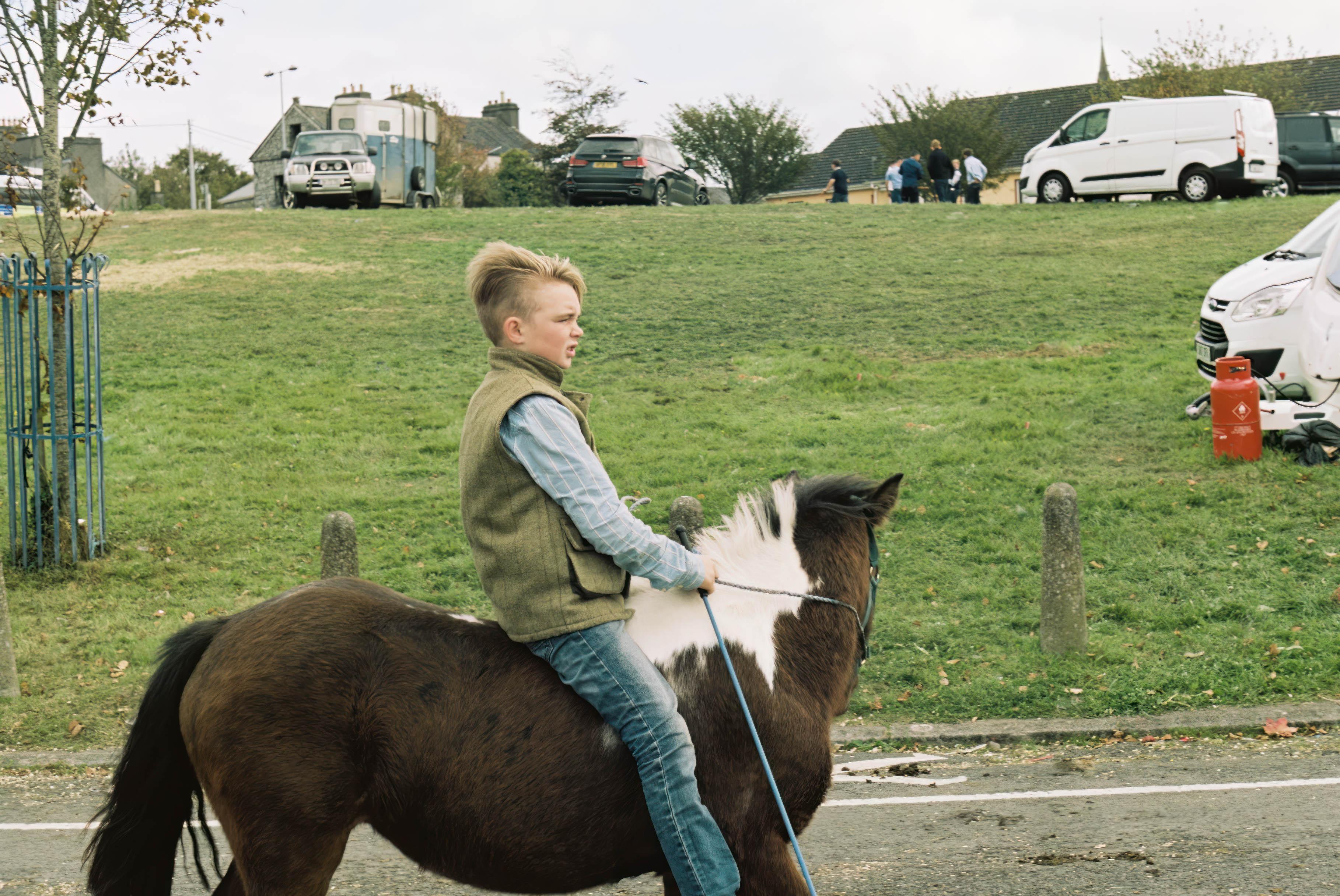 Marion Bergin Animal Print - Irish Traveller Child, Ballinasloe Horse Fair, Ireland 2018
