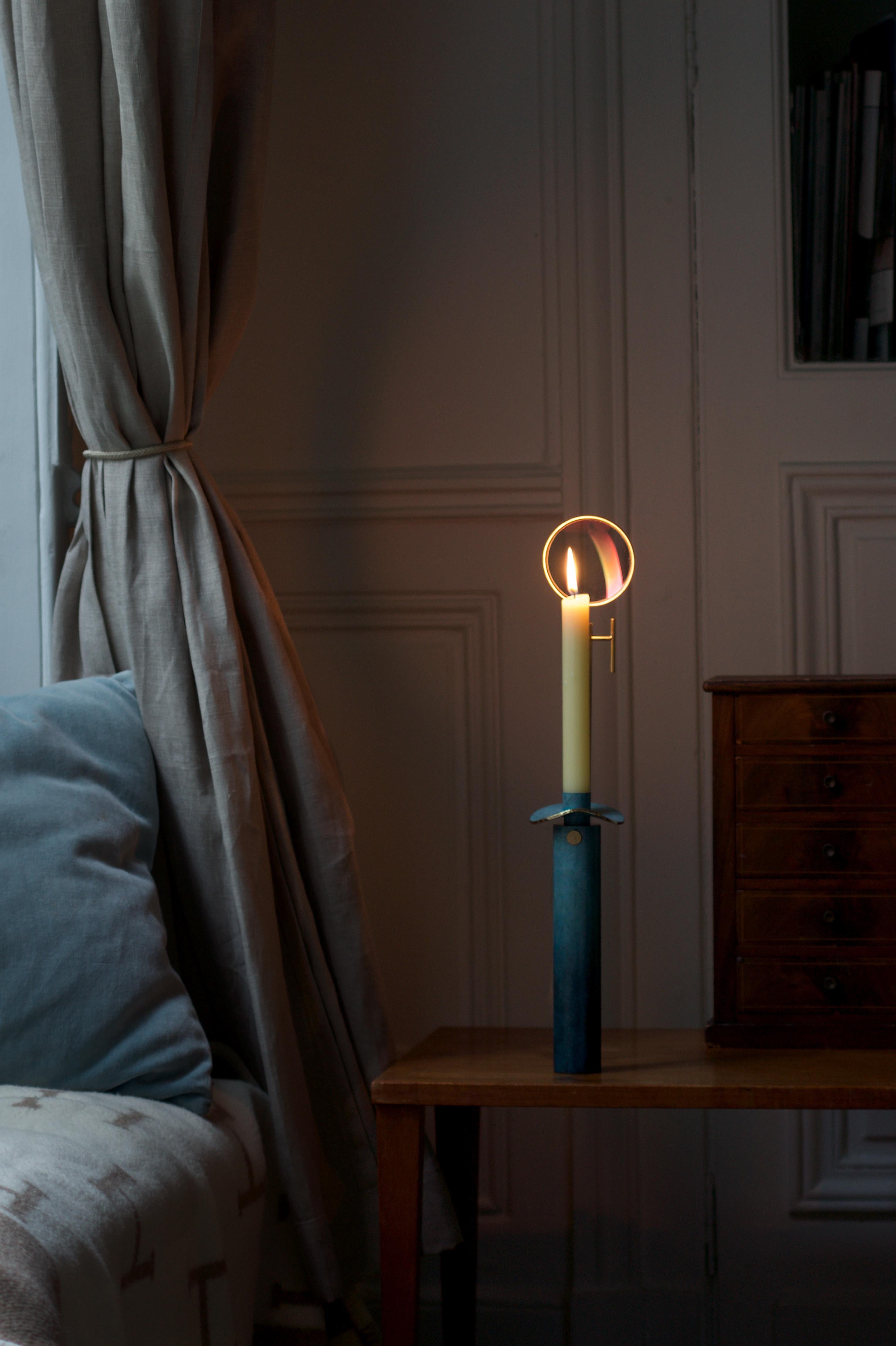 The Ernest candlestick, made by Marion Mezenge,  is part of the Astérie series created between 2019 and 2020.It is made of oiled brass and glass, the foot and the bobeche are patinated blue.

dimensions: 18.5