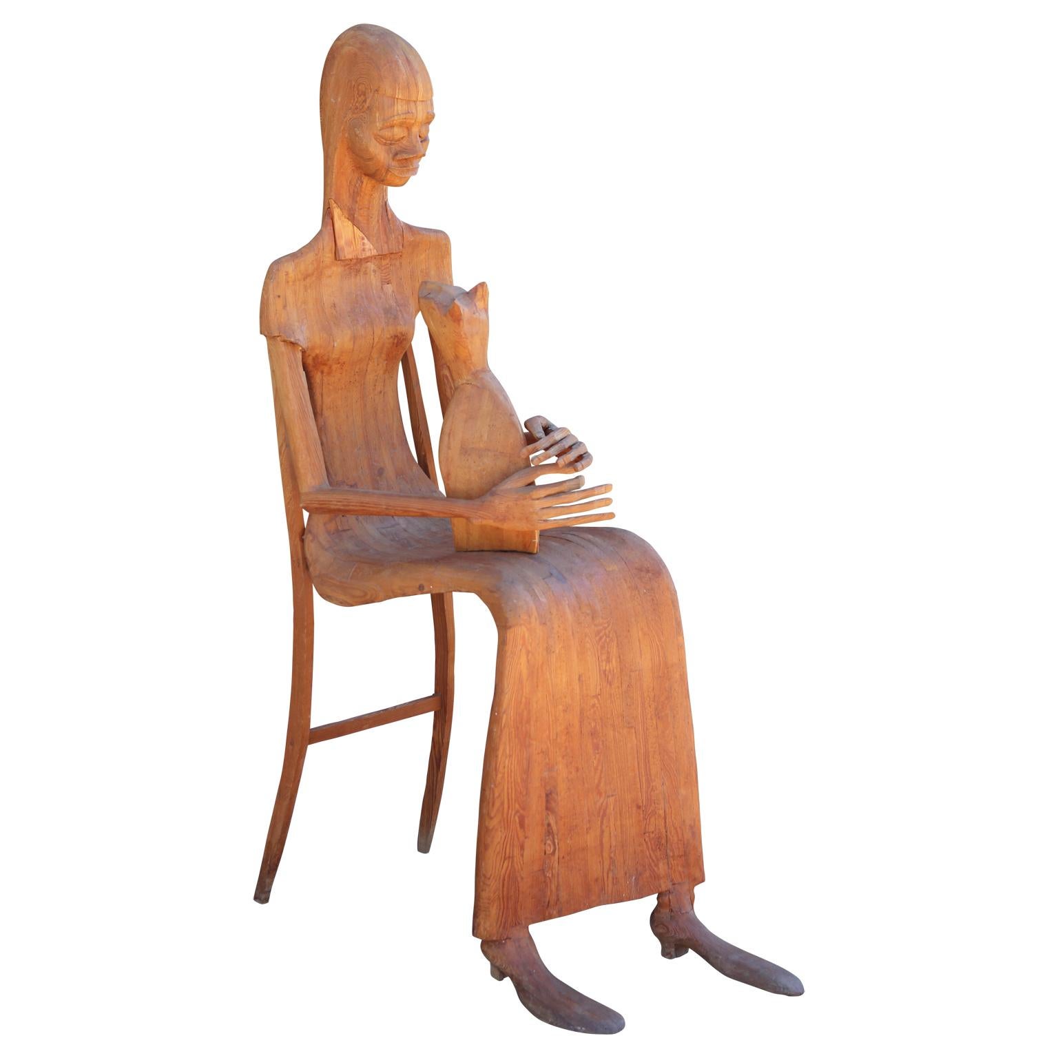 Marion Perkins Figurative Sculpture - Modern Hand Carved Wooden Folk Sculpture of a Seated Woman with a Pet Cat 