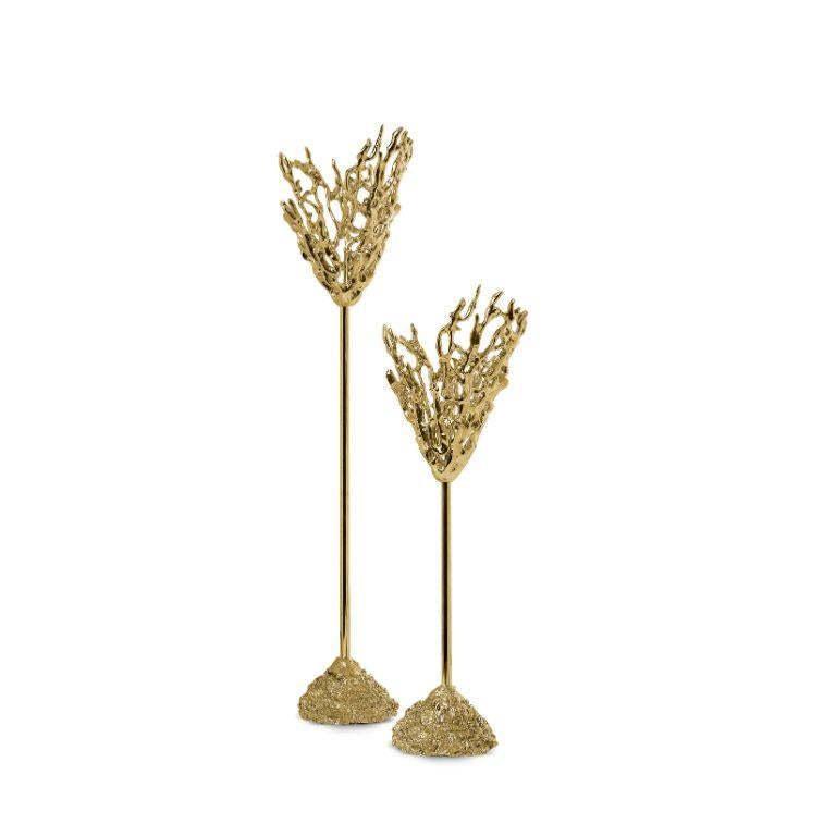 This Maris candlesticks, glimmer magnificently whether or not they hold lit candles.  Designed to place a candle, with a lacy cut, it suggests the corals in the depths of the ocean. The light-scattering properties of gorgeous polished metal