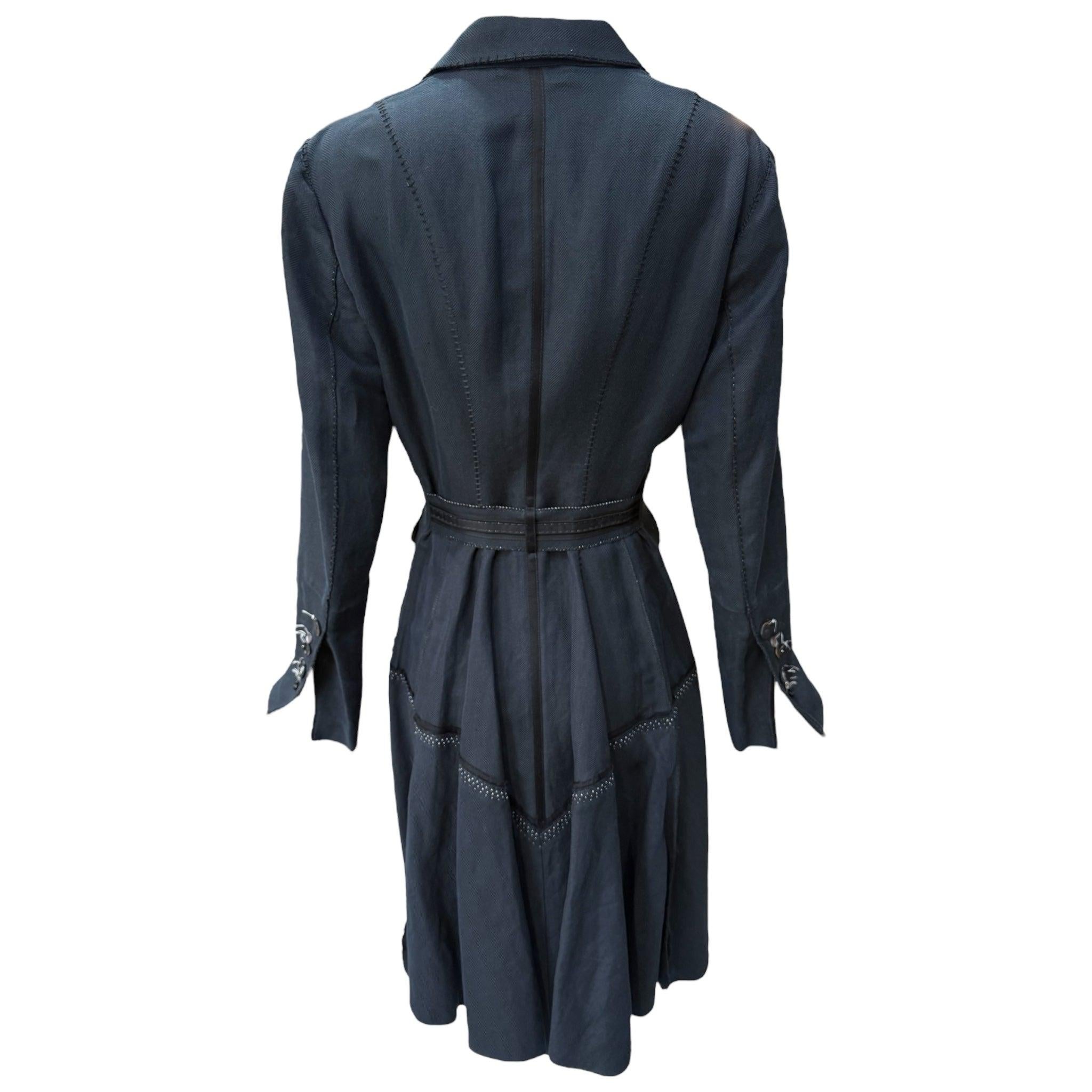 Funky, semi-deconstructed double breasted coat, made of a lightweight linen and cotton blend herringbone weave. Unlined, with really cool mismatched covered metal buttons and 