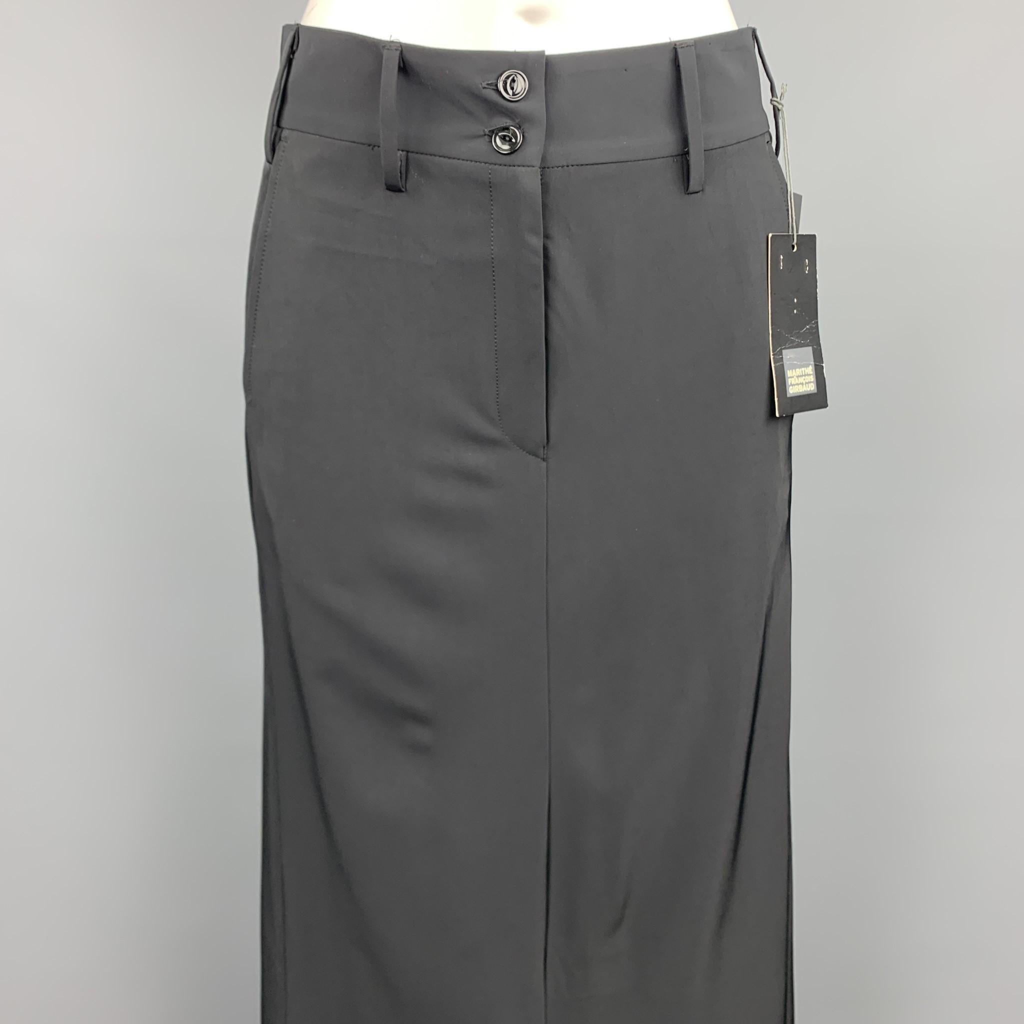 MARITHE+FRANCOIS GIRBAUD long skirt comes in a black polyester blend featuring a black slit, back belt detail, and a zip fly closure. Made in Italy.

New With Tags.
Marked: IT 42

Measurements:

Waist: 32 in. 
Length: 41 in. 