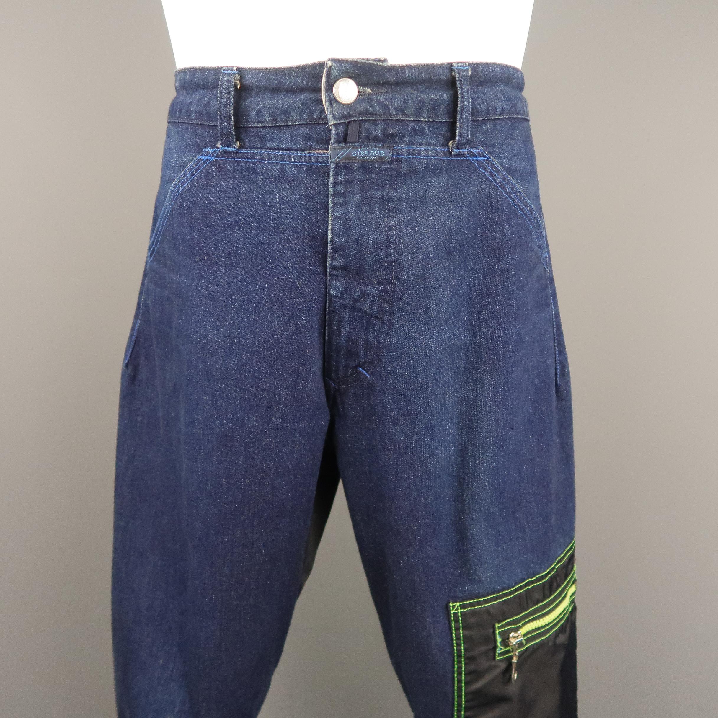 Vintage 1990's MARITHE+FRANCOIS GIRBAUD jeans come in classic indigo blue denim with a black nylon patch zip pocket, neon green stitch details, zip cuffs, and nylon back panel. Minor wear on back panel. As-is. Made in Italy.
 
Good Pre-Owned